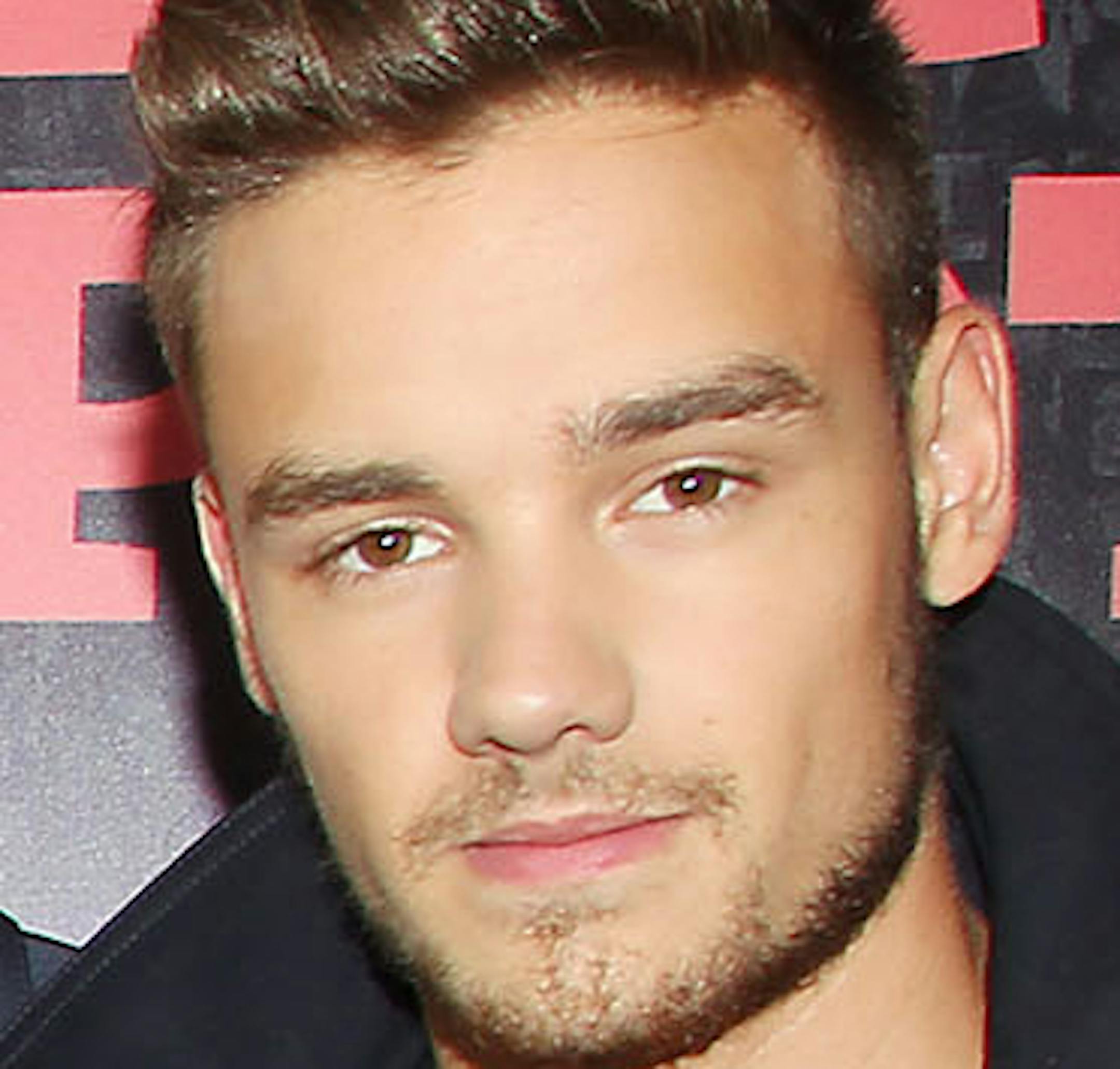 This image released by Starpix shows director Morgan Spurlock, second right, with members of One Direction, from left, Niall Horan, Louis Tomlinson, Zayn Malik, Harry Styles, and Liam Payne, right, at the premiere of the film "One Direction: This Is Us," at the Ziegfeld Theatre in New York on Monday, Aug. 26, 2013. (AP Photo/Starpix, Dave Allocca) ORG XMIT: MIN2013090313332869