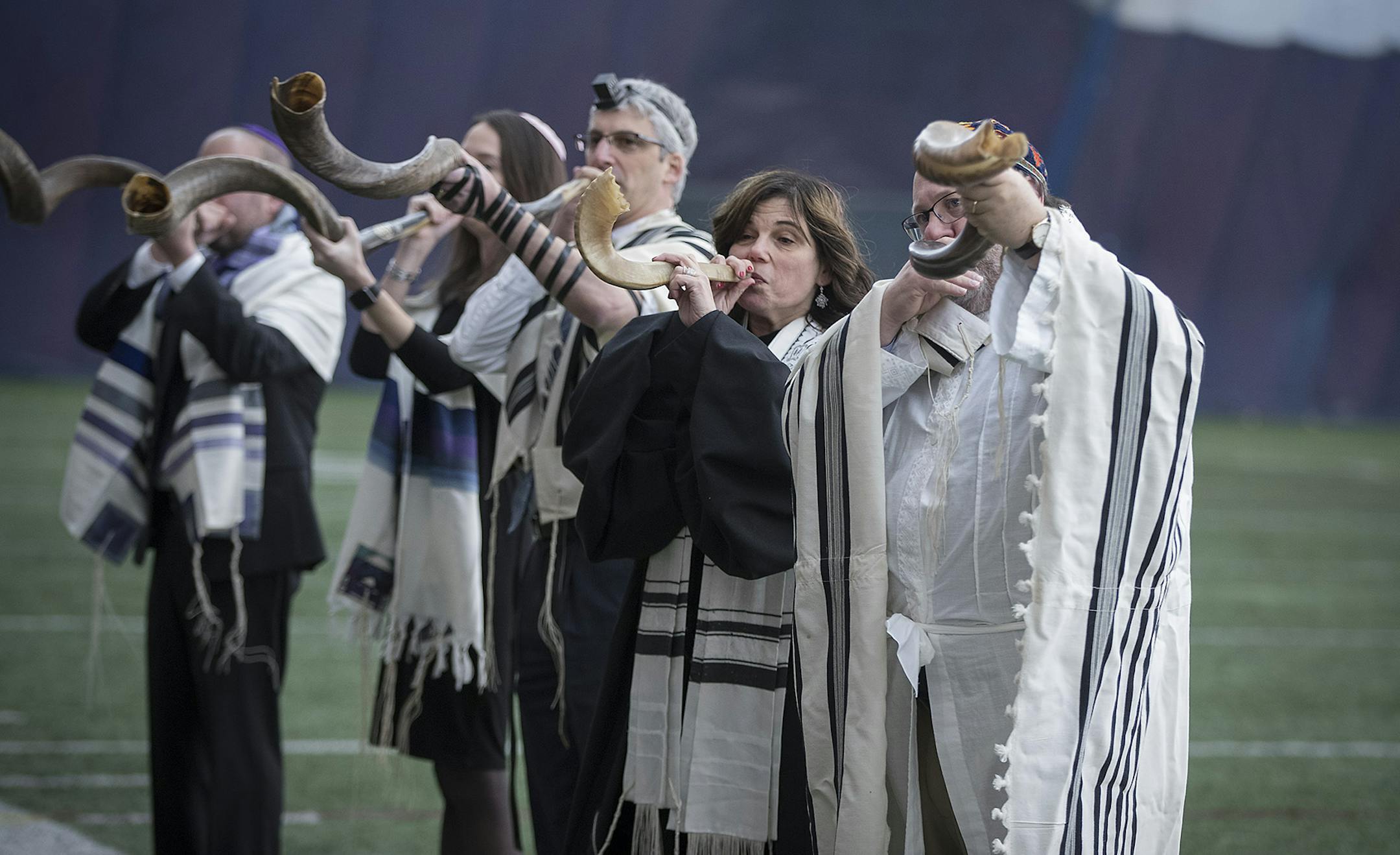 Local Jewish leaders blew on a Shofar during the filming of a football commercial featuring about 30 religious leaders to benefit the Downtown Congregations to End Homelessness in the Augsburg Sports Dome, Friday, January 12, 2018 in Minneapolis, MN. ] ELIZABETH FLORES &#xef; liz.flores@startribune.com
