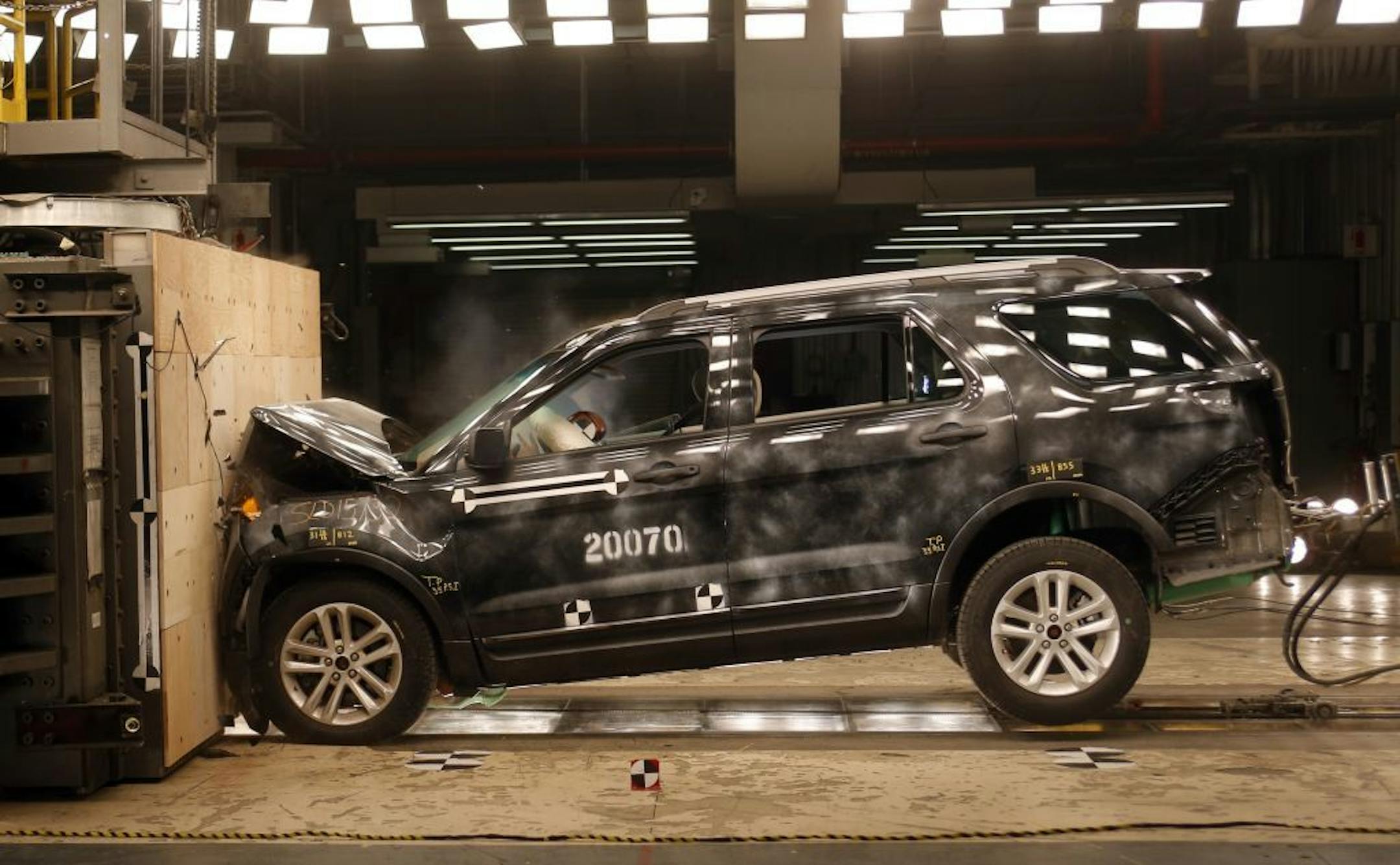 A 2014 Ford Explorer collides with a barrier during a crash test demonstration. The Explorer got a "marginal" rating in an insurance industry crash test.