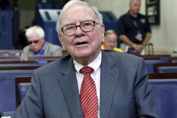 FILE- In this Monday, July 18, 2011, file photo, Warren Buffett is interviewed in the White House Briefing Room in Washington, following a meeting wit