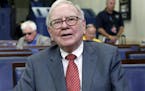 FILE- In this Monday, July 18, 2011, file photo, Warren Buffett is interviewed in the White House Briefing Room in Washington, following a meeting wit