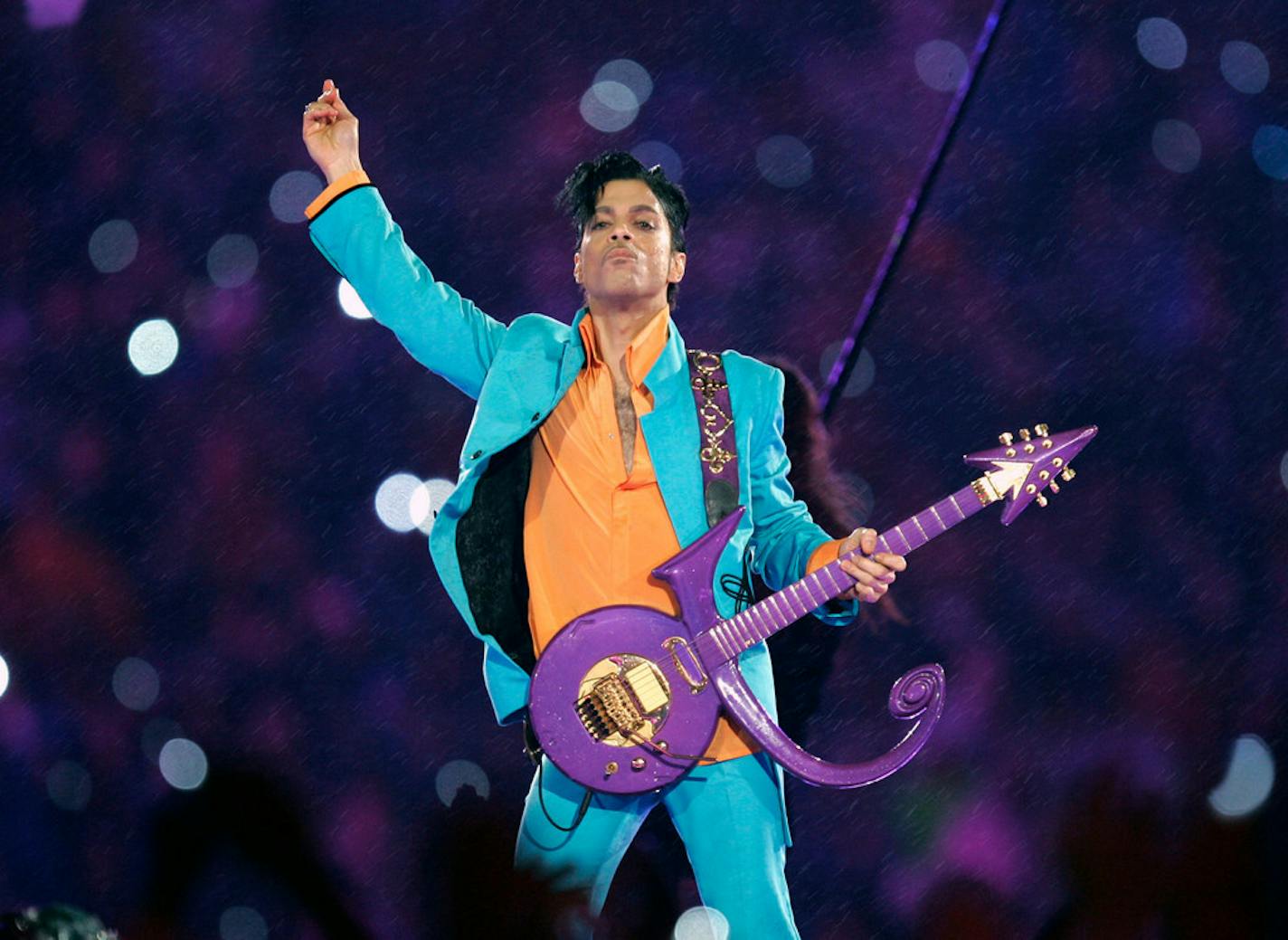 In this Feb. 4, 2007 file photo, Prince performs during the halftime show at the Super Bowl XLI football game at Dolphin Stadium in Miami.