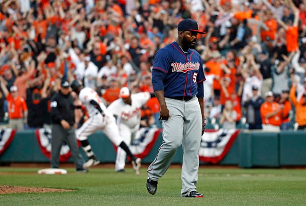 Twins reliever Fernando Rodney walked off the field after giving up a solo home run to the Orioles' Adam Jones in the 11th inning Thursday.