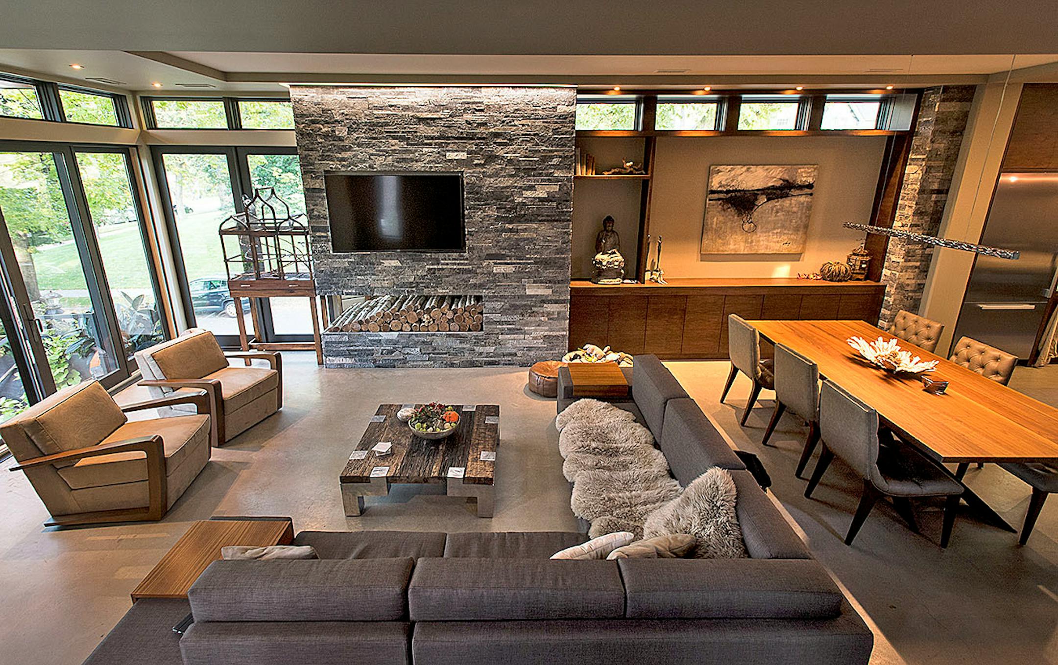 The clean-lined modern home of Ashii and Ippo Vrohidis features walls of glass framing expansive views of Lake Calhoun. Ashii incorporated objects and ideas from her travels around the globe.