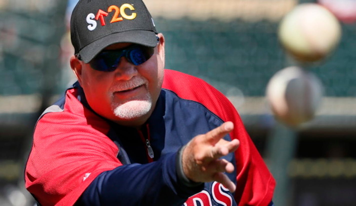 Twins manger Ron Gardenhire tossed balls during  batting practice before theTwins home opener at Target Field against the Oakland A's Monday April 7, 2014 in Minneapolis , MN. ]JERRY HOLT jerry.holt@startribune.com