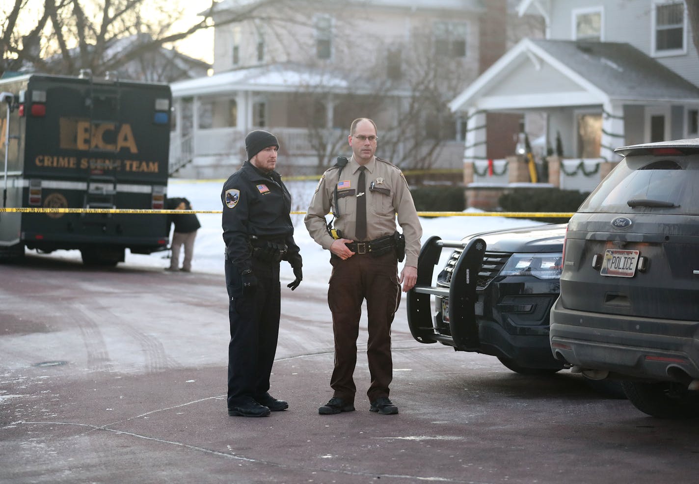 Law enforcement officers were at the scene Tuesday morning in Waseca, Minn., after a police officer and a suspect were shot Monday night following reports of a disturbance in a residential neighborhood.