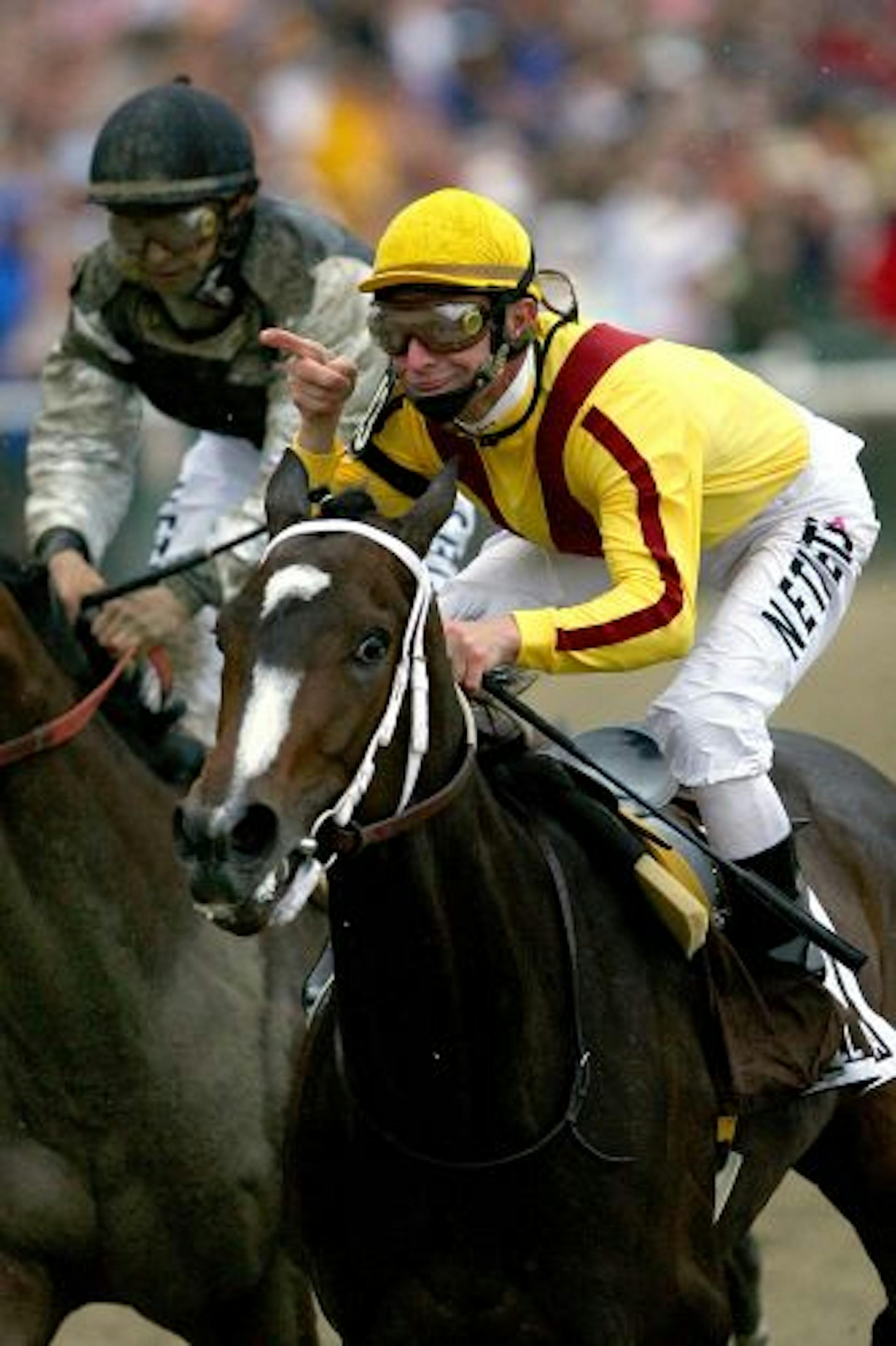 Calvin Borel, riding Rachel Alexandra, crossed the finish line ahead of Mine That Bird to win the 134th Preakness Stakes