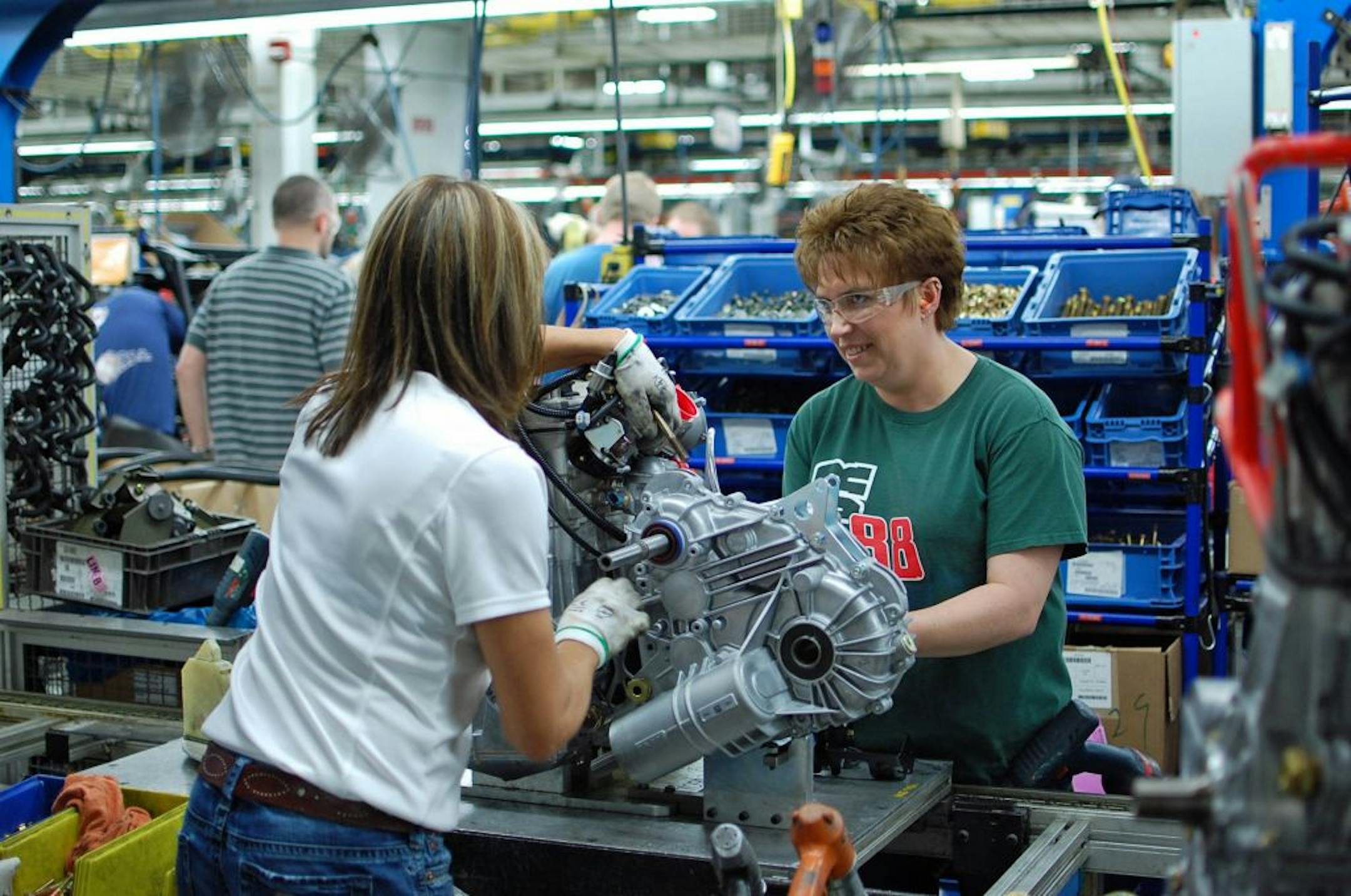 Workers prepare engines for installation into Polaris' Ranger side-by-side vehicles at the company's plant in Roseau, Minn. on Wednesday, March 30, 2011. The plant employs 1,400 people, making it the largest employer in town. The wave of retiring baby boomers means Polaris will have to hire hundreds of new workers over the next few decades just to maintain current staffing levels.
