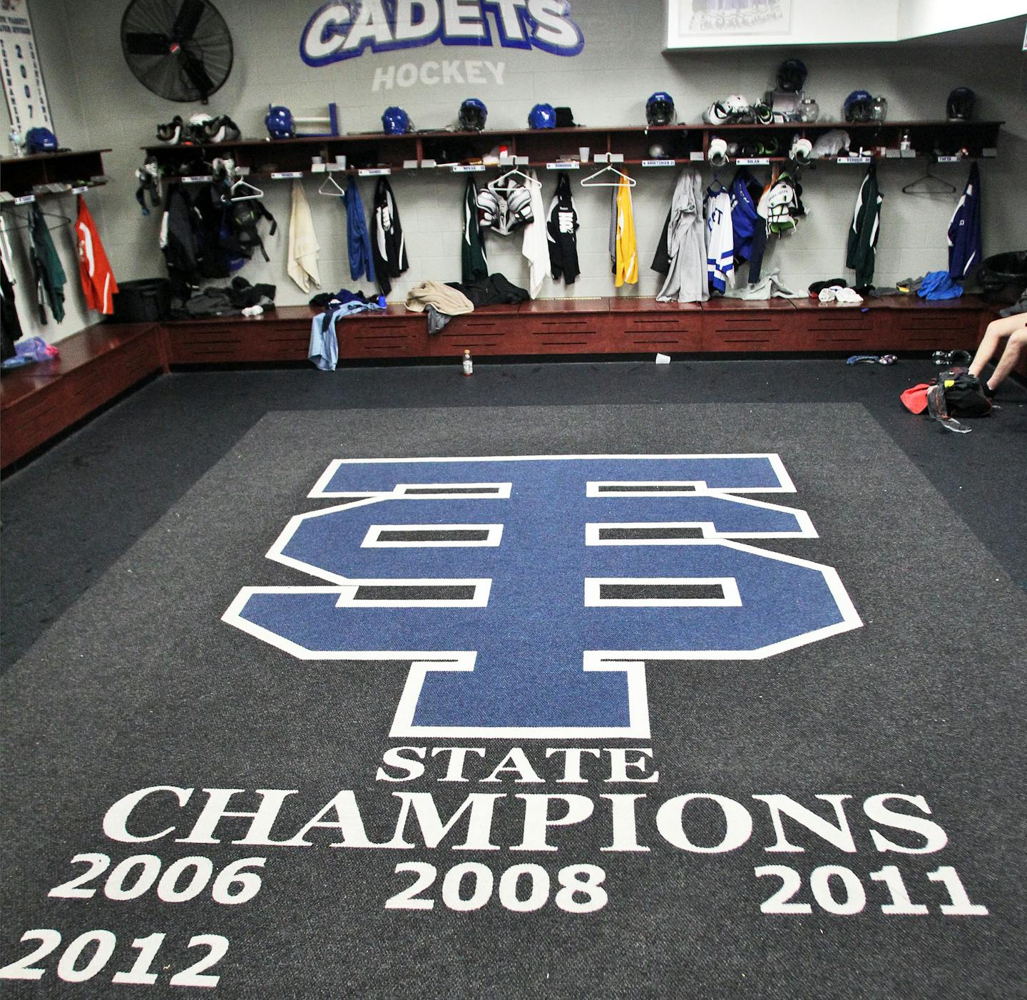 Private donations financed the building of St. Thomas Academy's $4.4 million ice arena — and a hockey parent designed the locker room carpet logo.