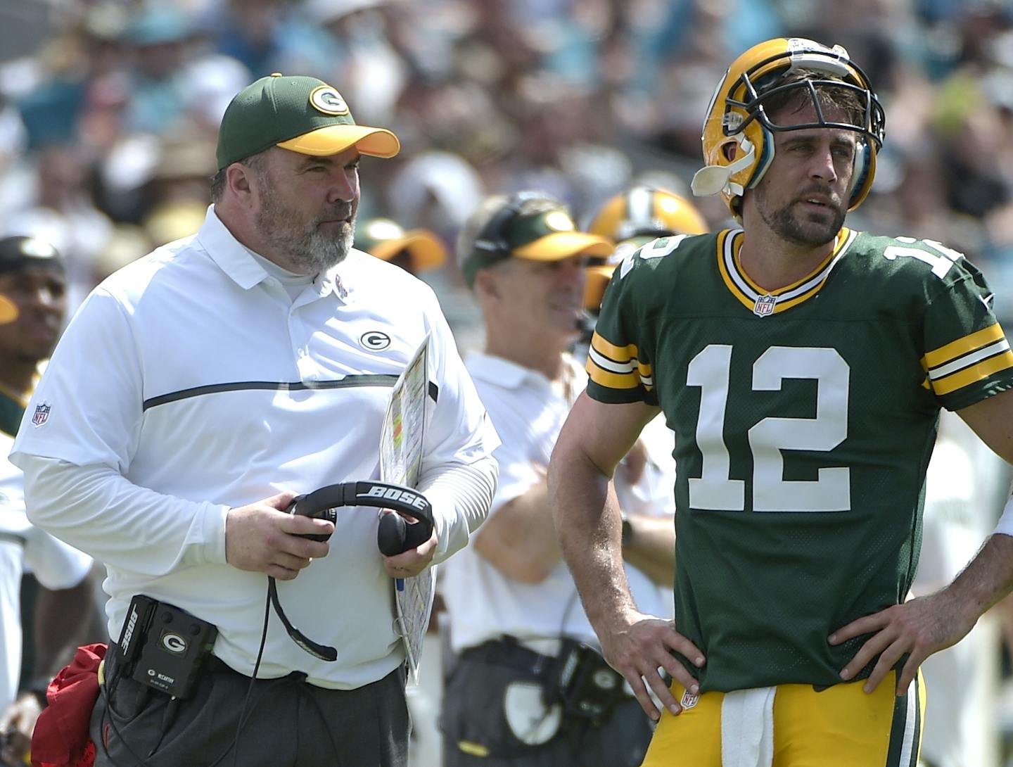 Green Bay Packers head coach Mike McCarthy and quarterback Aaron Rodgers (12) chat on the sideline during the second half of an NFL football game against the Jacksonville Jaguars in Jacksonville, Fla., Sunday, Sept. 11, 2016. The Packers won 27-23. (AP Photo/Phelan M. Ebenhack)