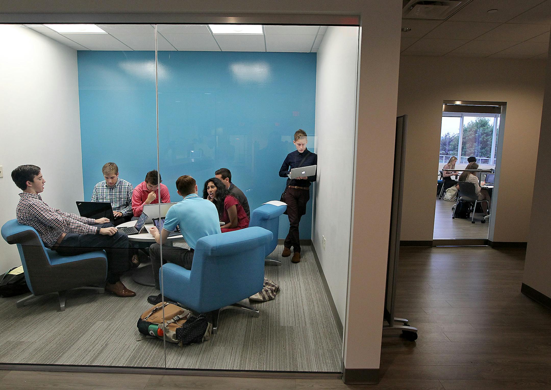 Minnetonka High School students in the VANTAGE advanced professional program, worked together on a business project in a meeting room, Thursday, September 24, 2015 in Minnetonka, MN. The VANTAGE program, set off campus in a business building, functions like an MBA. It's an intensive program to prepare business-minded students for entrance into the real world with skills in entreprenuership, leadership and analytics, emphasizing the attractiveness of business for high-performing students. ] (ELIZ