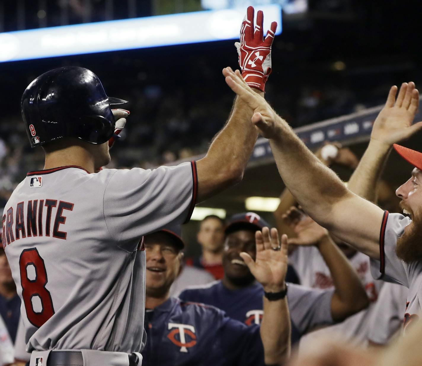 Minnesota Twins' Zack Granite is greeted after his three-run home run during the eighth inning of a baseball game against the Detroit Tigers, Saturday, Sept. 23, 2017, in Detroit. (AP Photo/Carlos Osorio)