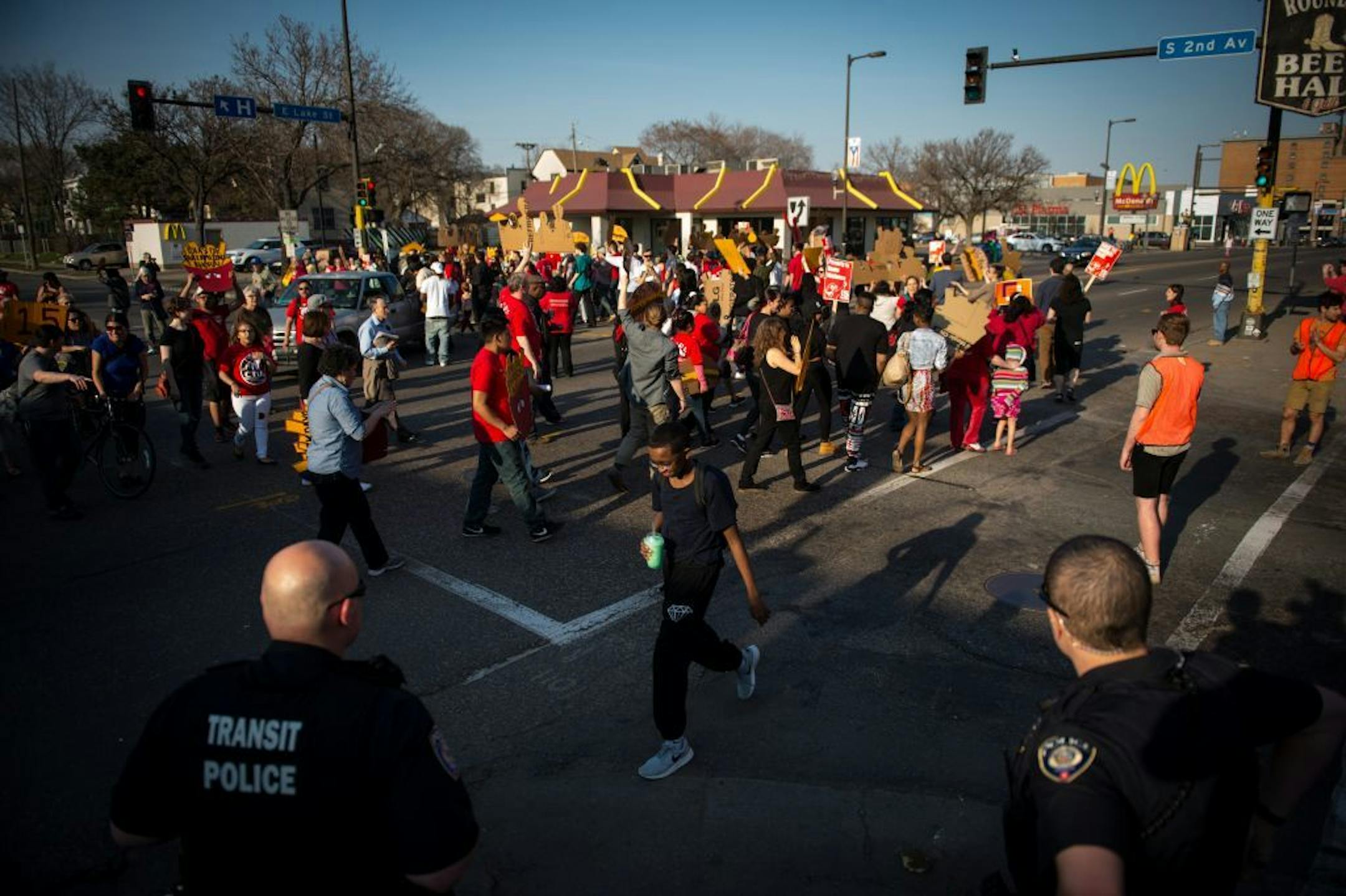 Demonstrators marched in circles and blocked off traffic at East Lake Street and Second Avenue South while protesting for an increase in minimum wage.