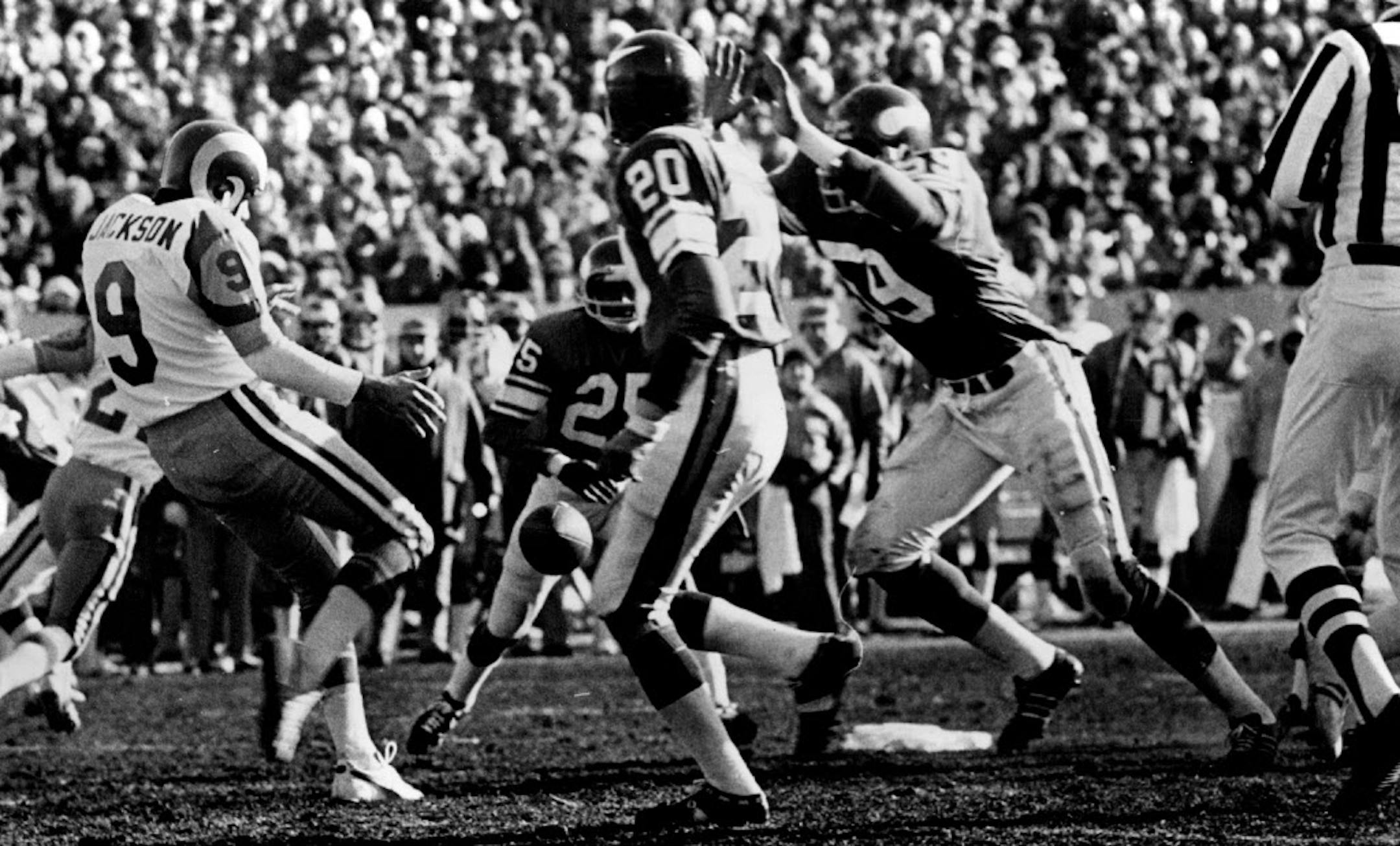 1976. Matt Blair (59) was about to block a punt by the Rams 'Rusty Jackson in the second quarter. The Vikings recovered inside the Los Angeles 10-yard line. Ready to help were Nate Allen (25) and Bobby Bryant (20).