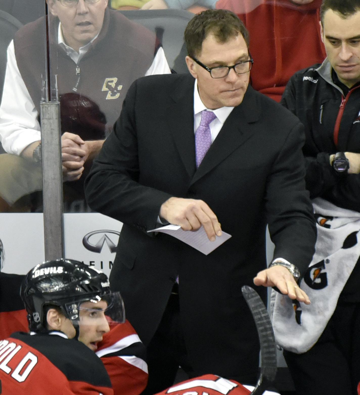 New Jersey Devils defensive coach Scott Stevens talks to the team during the second period of an NHL hockey game against the Vancouver Canucks Friday, Feb. 20, 2015, in Newark, N.J. (AP Photo/Bill Kostroun) ORG XMIT: NJOTK