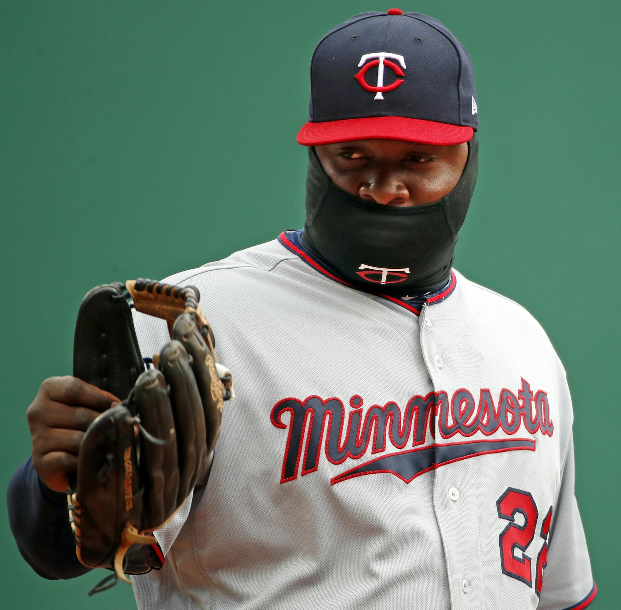 Minnesota Twins third baseman Miguel Sano waves his glove to a fan during a baseball game against the Pittsburgh Pirates in Pittsburgh, Monday, April 2, 2018. (AP Photo/Gene J. Puskar)