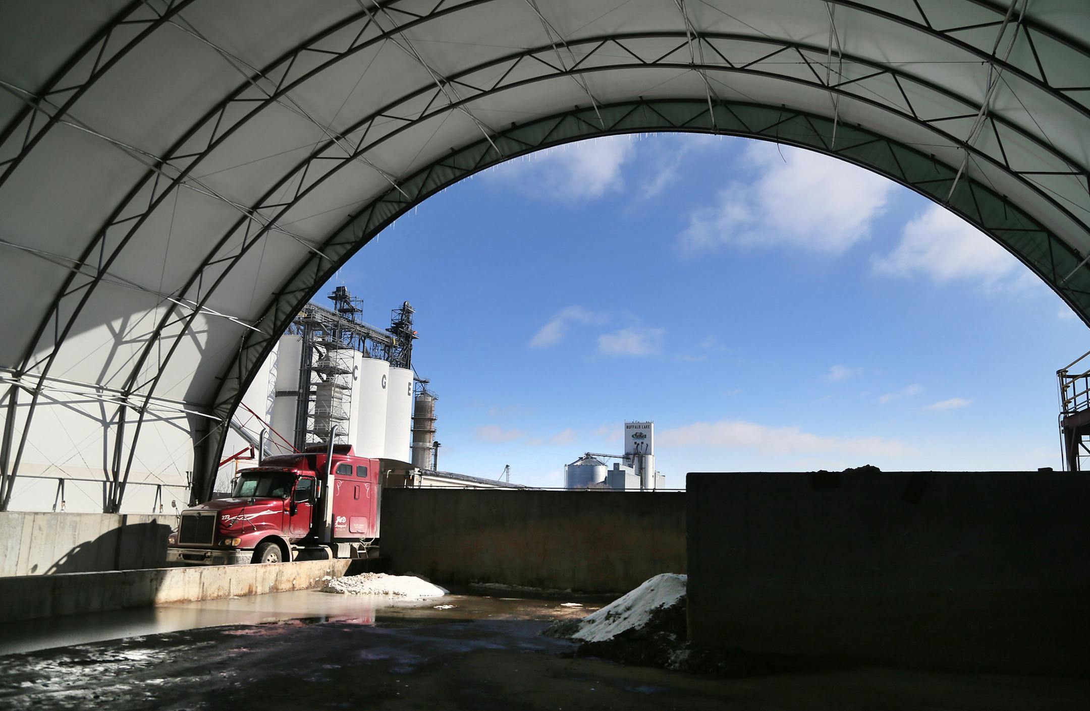 A semi-truck pulls through the wet grain storage area Wednesday, Feb. 11, 2015, at Buffalo Lake Advance Biofuels in Buffalo, MN.](DAVID JOLES/STARTRIBUNE)djoles@startribune.com In the ethanol business, being old and small is a path to losing money. Some of the early ethanol plants built in the 1990s are struggling to compete against newer plants that are four or five times larger and more efficent. The small plant in this community has been shuttered twice as it went through bankruptcy court, No
