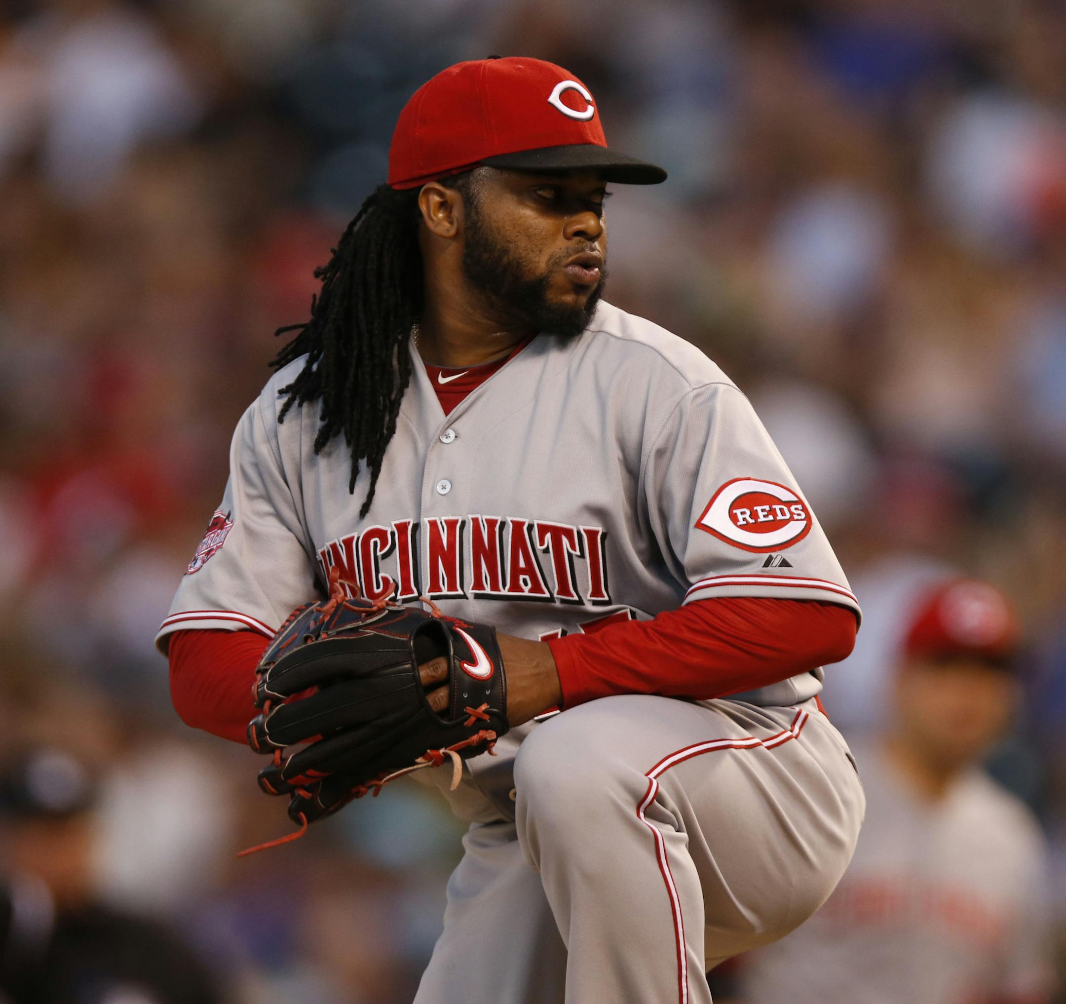 Cincinnati Reds starting pitcher Johnny Cueto (47) works against the Colorado Rockies in the seventh inning of a baseball game Saturday, July 25, 2015, in Denver. Cincinnati won 5-2. (AP Photo/David Zalubowski)