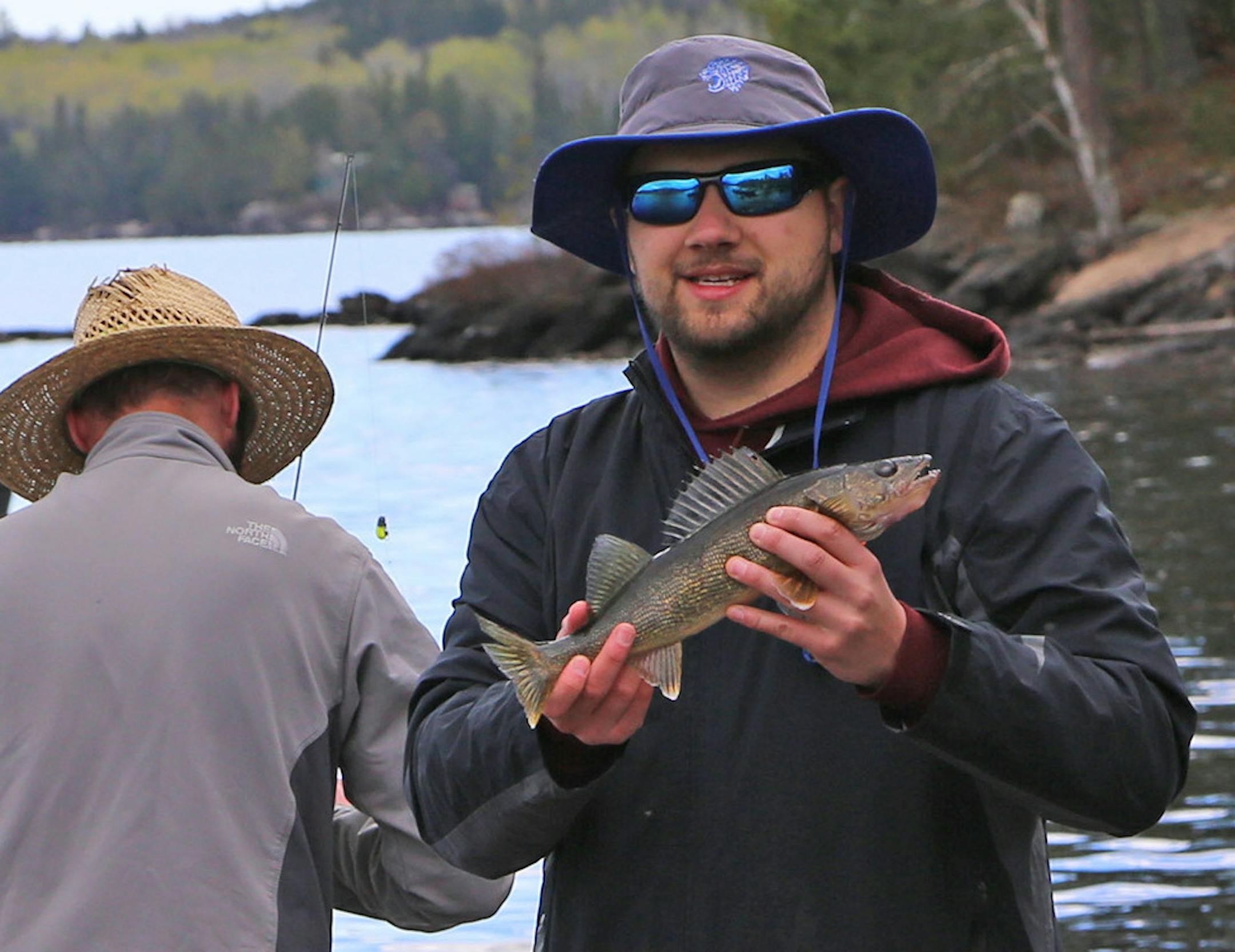Chris Stavnes of Minneapolis was all smiles after catching a plump walleye Saturday morning while fishing on Crane Lake near the Minnesota-Ontario border.