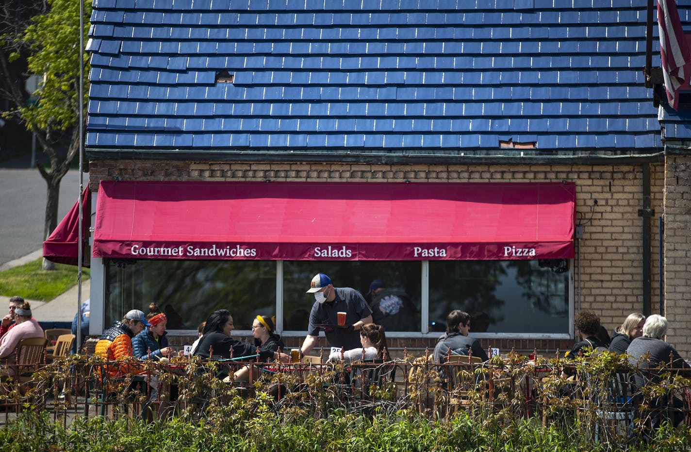 Duluth diners enjoyed outdoor seating at Sir Benedict's Tavern on the lake in Duluth, MN on the first day of Governor Walz's phased re-opening of the state that began on Monday. ] ALEX KORMANN • alex.kormann@startribune.com The next step in Governor Walz's phased re-opening of the state began on Monday June 1, 2020. Salons and barbershops were allowed to open back up while restaurants were allowed to open outdoor and patio seating.