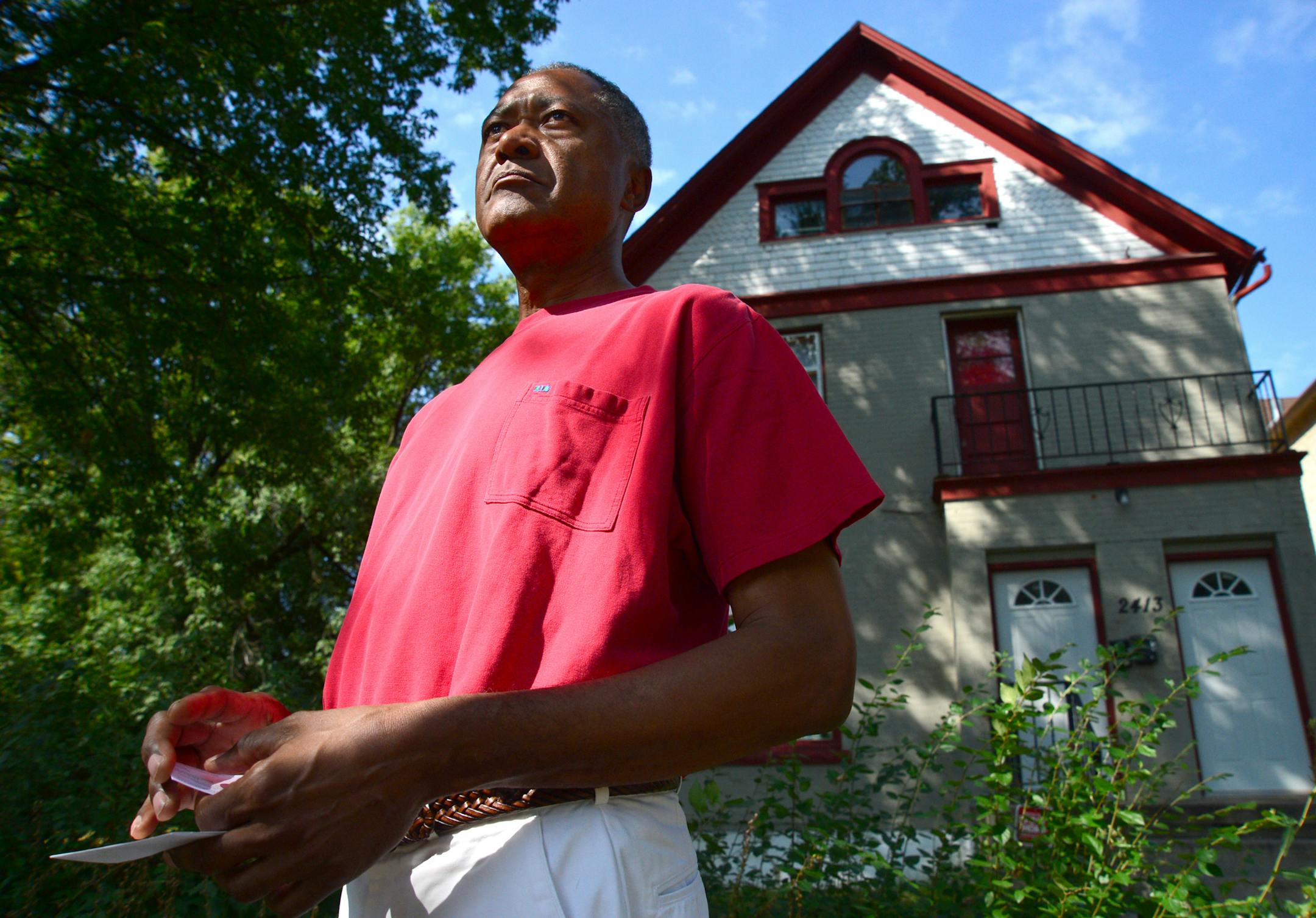 Minneapolis City Councilman Don Samuels set up a table in front of the shooting scene to talk to community members and talked to the media about how angry he was about the shooting and the easy availability of guns in North Minneapolis.