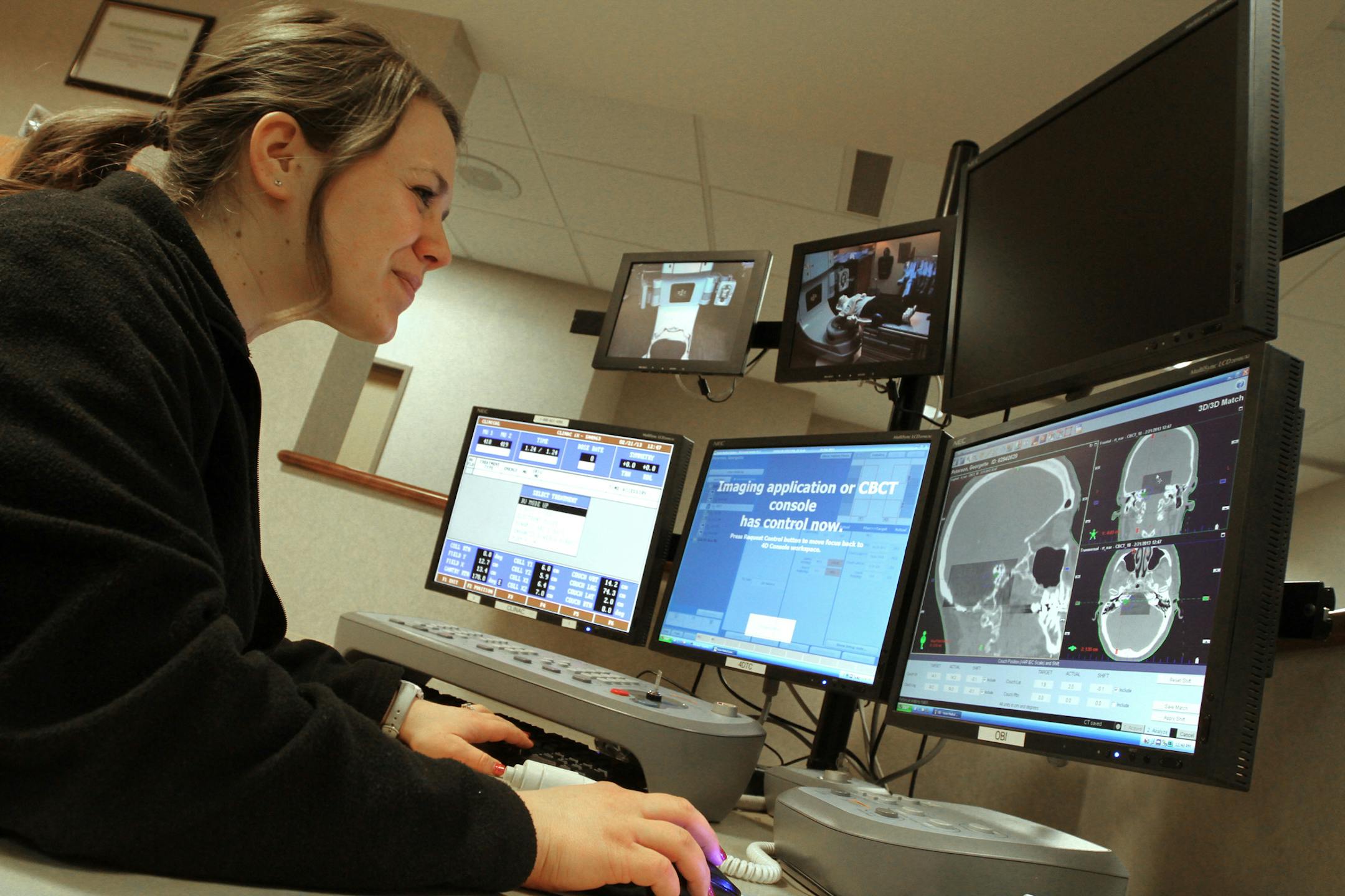 Radiation therapist Jacquie Sikorski monitored Georgette Peterson of Newport during a radiation treatment using a linear accelerator at Minnesota Oncology .