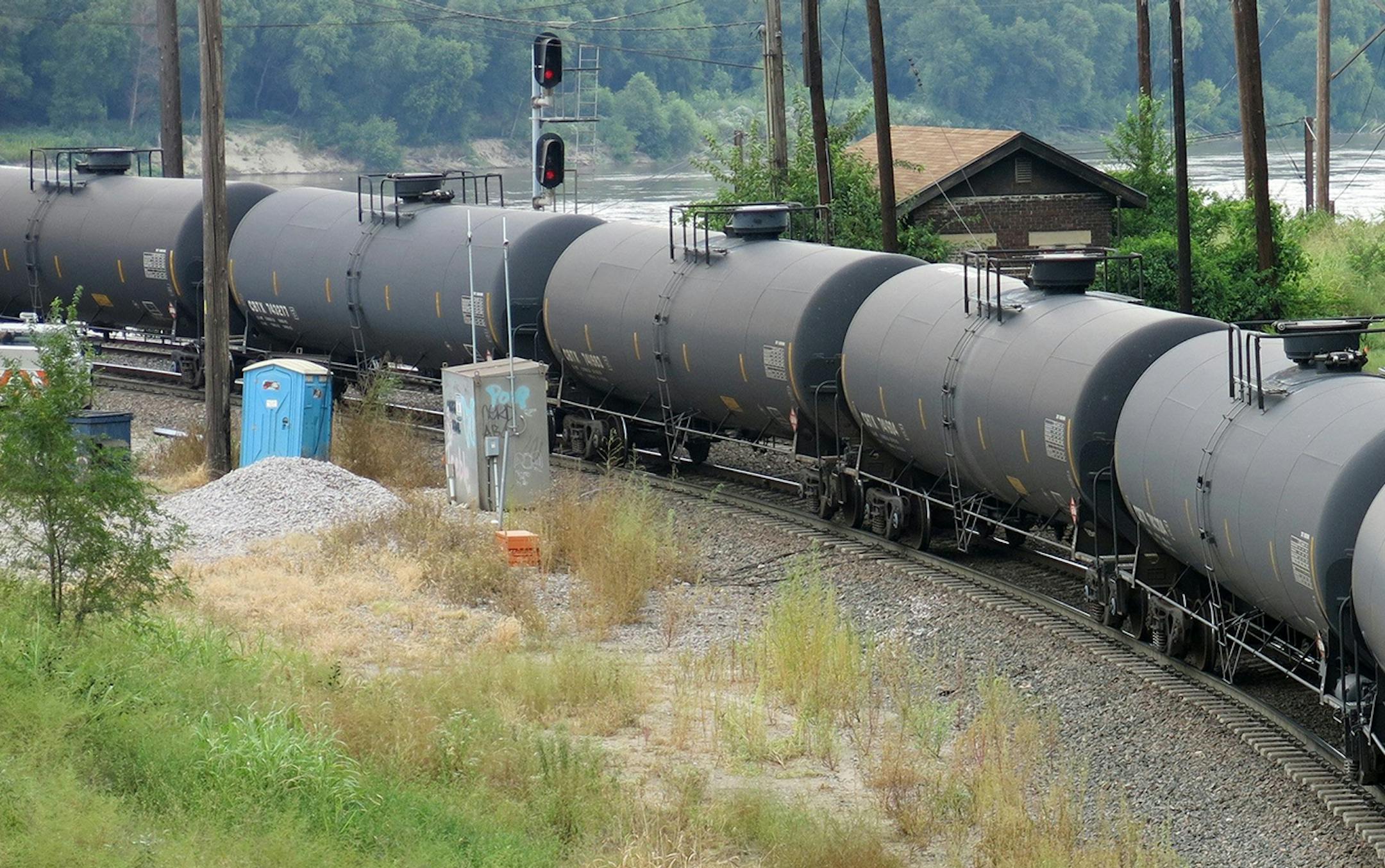 A BNSF Railway crude oil train snakes through the West Bottoms of Kansas City, Mo., on Aug. 29, 2014. Documents released by the Missouri State Emergency Management Agency show that as many as 10 trains carrying more than 1 million gallons of crude oil pass through Kansas City every week. However, the documents do not reveal whether other types of crude oil from Colorado, Wyoming or western Canada, move through the region. (Curtis Tate/McClatchy/MCT) ORG XMIT: 1157818