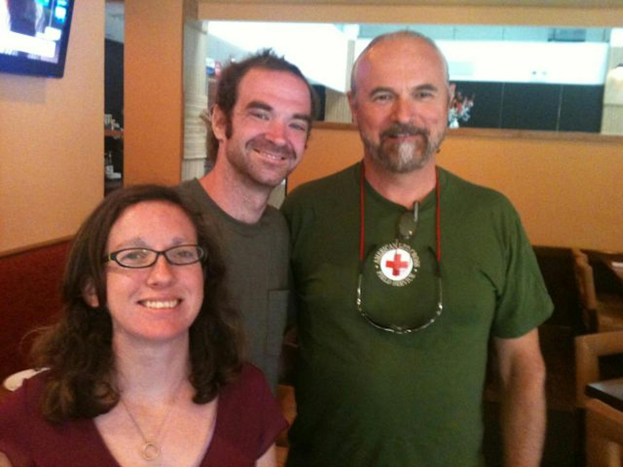 Jerry Smith, right, in Bradenton, Fla., with Danny and Leanne Pye, who run an orphanage in Haiti. Last month Smith flew Danny Pye from Haiti to Florida in time for the birth of the Pyes' second child.