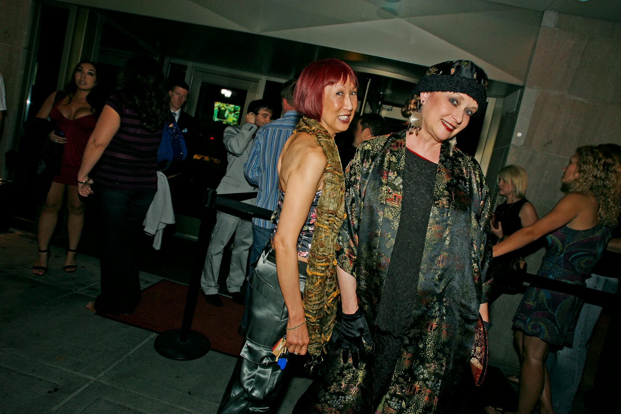 Caliann Lum, left, and Nancy Jones struck a pose wearing their best after they watched the Olympic Opening.