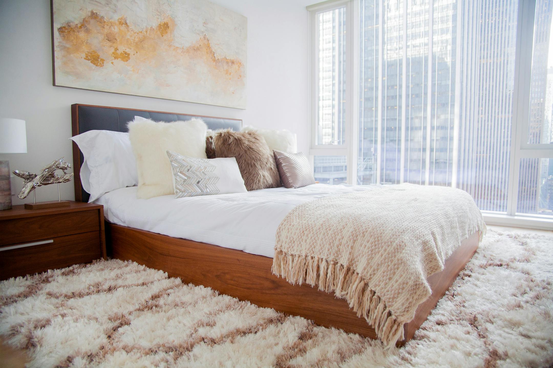 A low platform bed doesn't overcrowd a small master bedroom with a low ceiling.