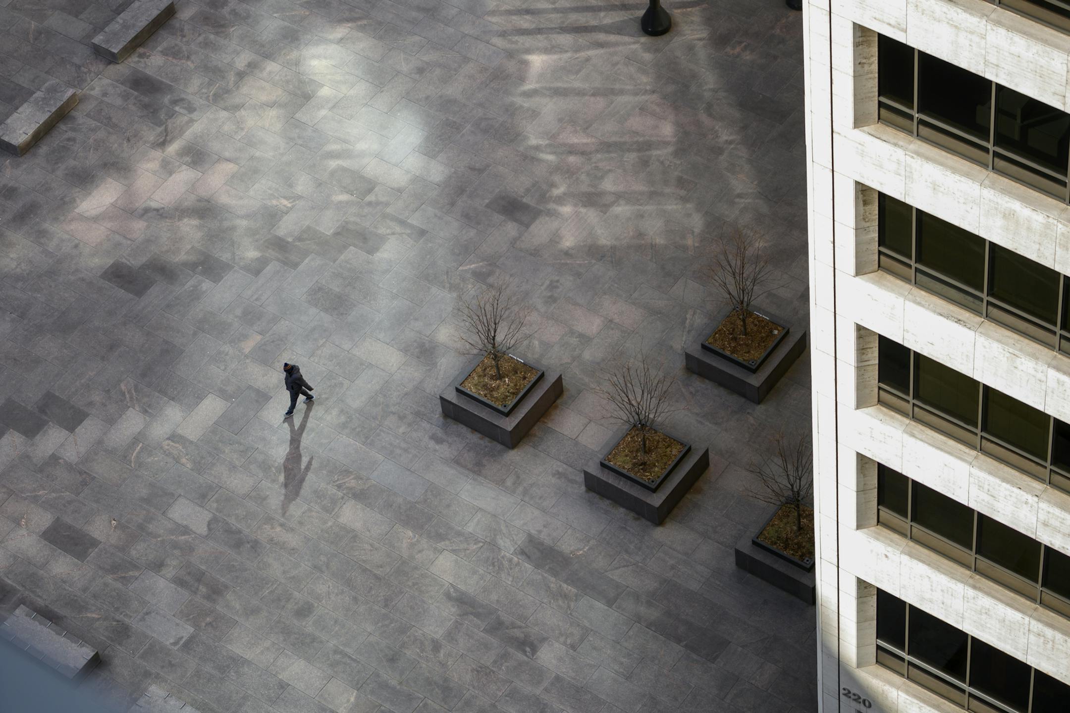 A lone pedestrian walked through US Bank Plaza in downtown Minneapolis Thursday afternoon.