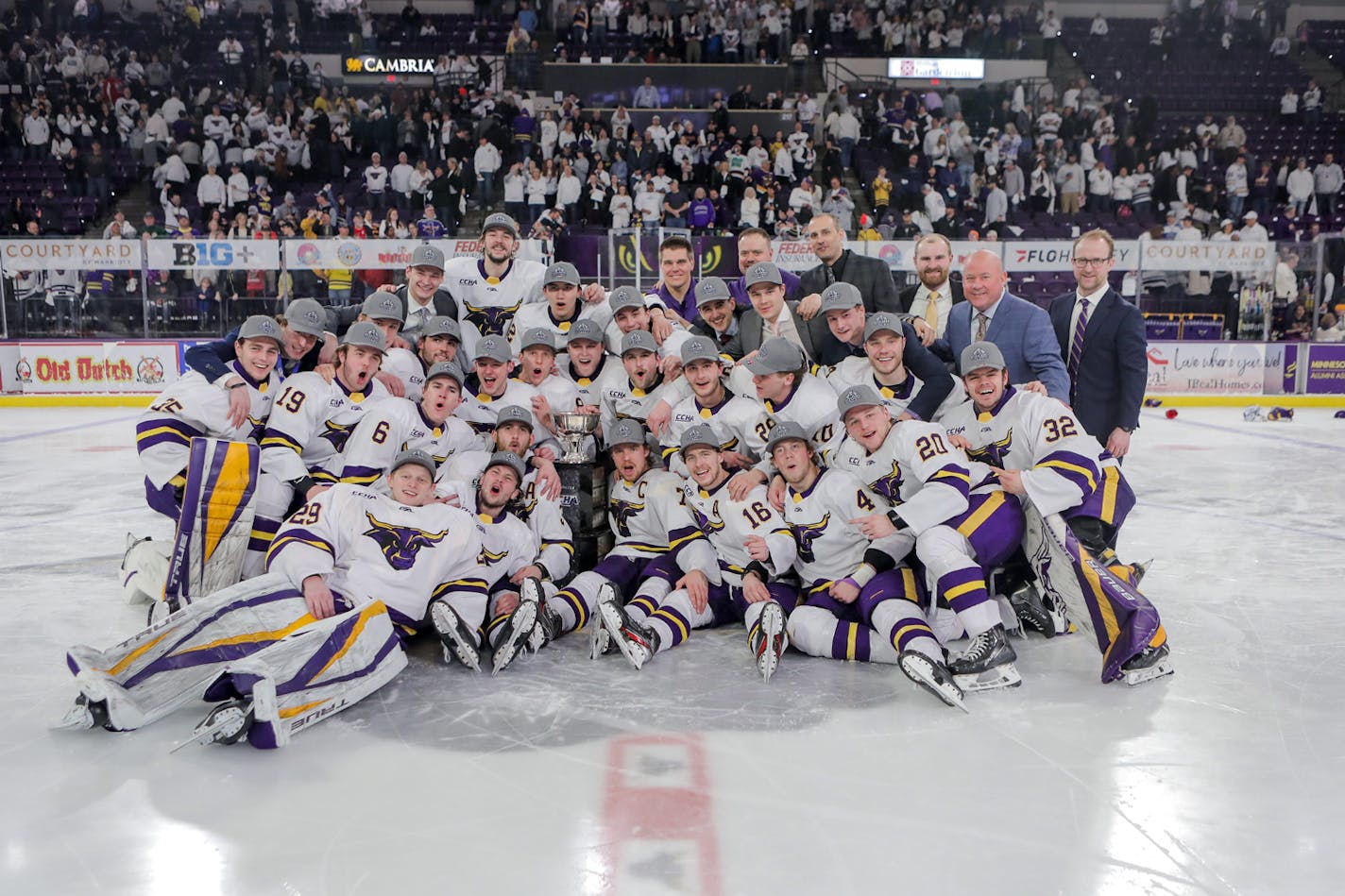 Minnesota State Mankato players celebrated on the ice Saturday night after Josh Groll (12) scored in overtime to beat Bemidji State for the CCHA title, March 19, 2022, in Mankato. Except that after this photo was taken, the goal was declared no good, both teams returned to the ice and the game was resumed. (David Faulkner, SPX Sports/Minnesota State Mankato)