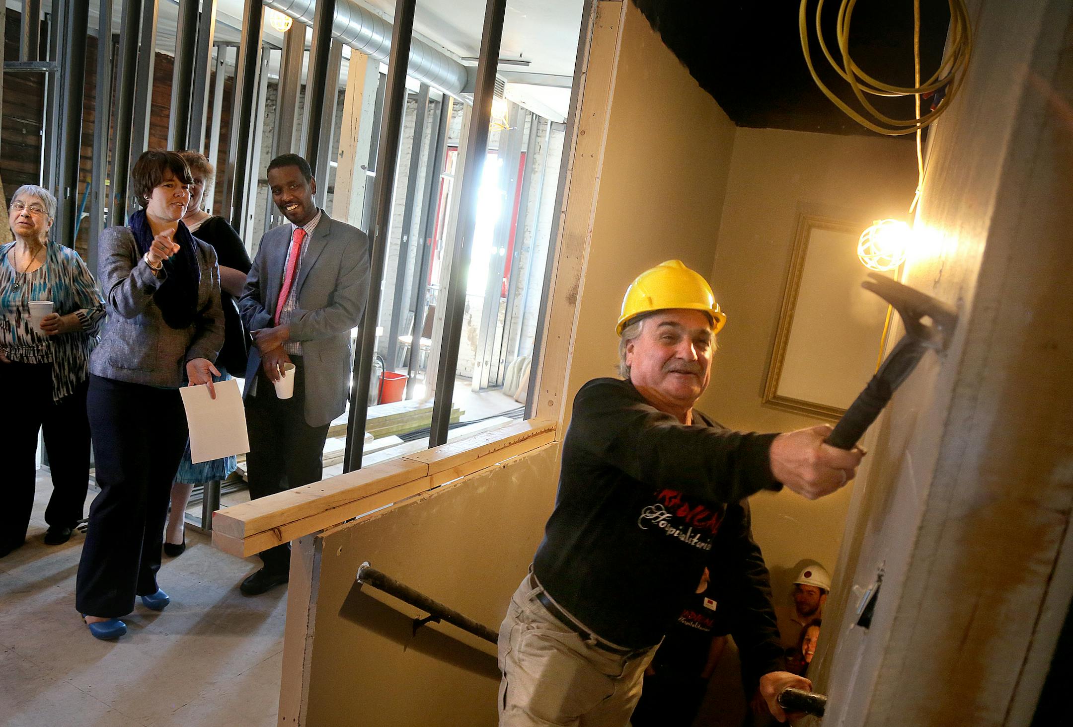The Minneapolis-based Mixed Blood Theater founder and Artistic director Jack Rueler let loose with a hammer to symbolize the beginning of a 2.4 million capital and social effort that will Transform the riverside area theater improvements. On May 21 friends of Mixed Blood gathered to celebrate the launch of Mixed Blood's capital and major gifts campaign: "-ism." The $2.4 million campaign, in pursuit of greater access for our Twin Cities communities, has a capital component that will involve the t