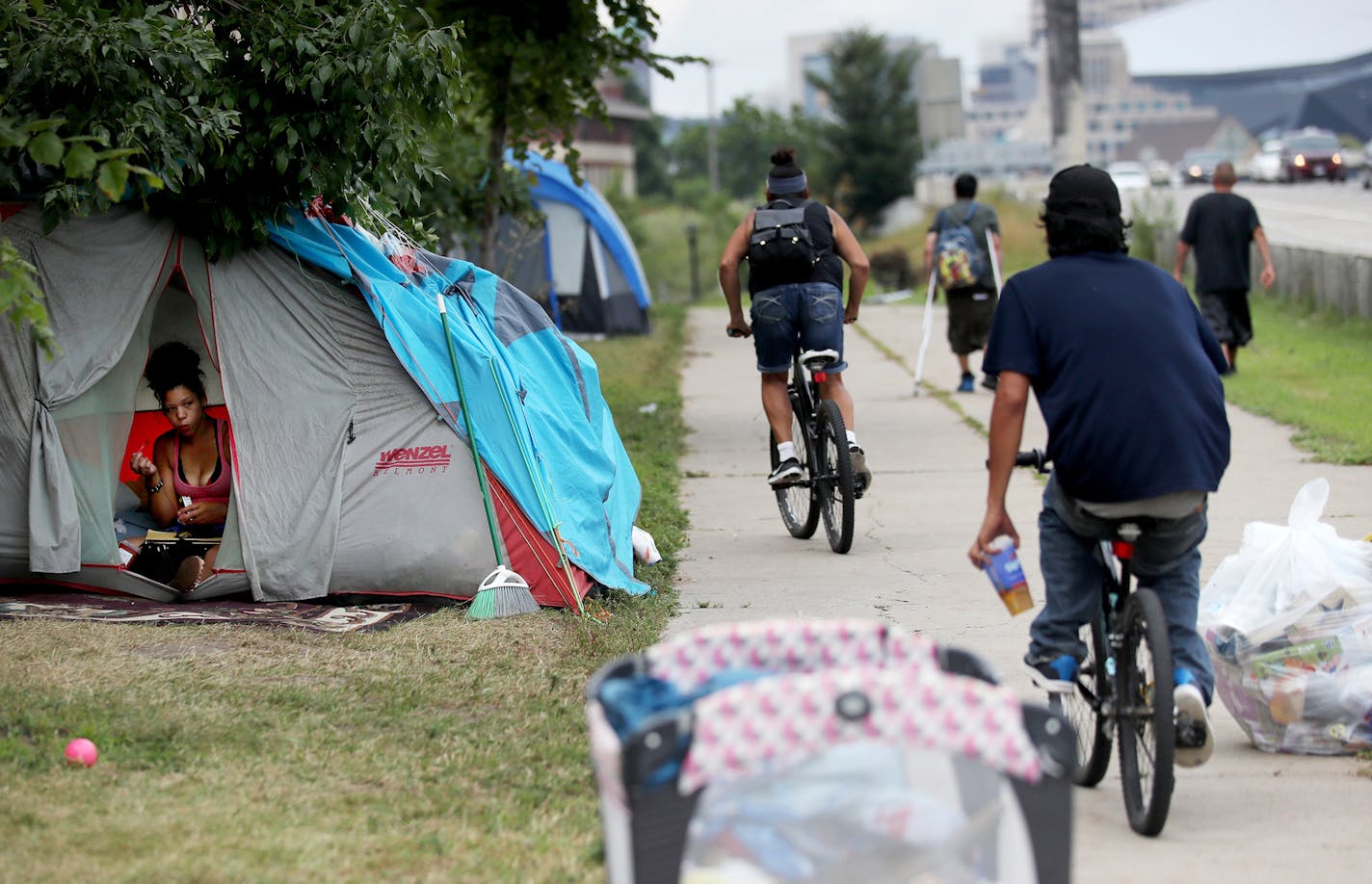 Kariece Wilson, 26, is among the more than 50 people who live at the large encampment along Hiawatha and Cedar Avenues and seen in her tent Tuesday, Aug. 7, 2018, in Minneapolis, MN. Wilson has collected more than 300 discarded syringes used by addicts to inject heroin since she moved into the encampment two weeks ago, and keeps them in her tent. "The (opioid) epidemic is getting worse," she said.