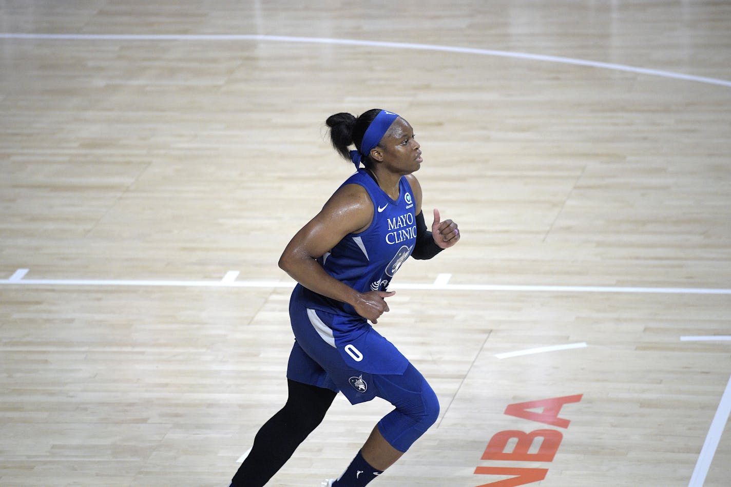 Minnesota Lynx guard Karima Christmas-Kelly (0) runs up the court during the first half of a WNBA basketball game against the Connecticut Sun, Sunday, July 26, 2020, in Bradenton, Fla. (AP Photo/Phelan M. Ebenhack)