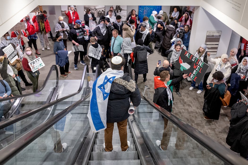 People reacted after the Minneapolis City Council voted on a resolution related to the Israel-Hamas war on Thursday.
