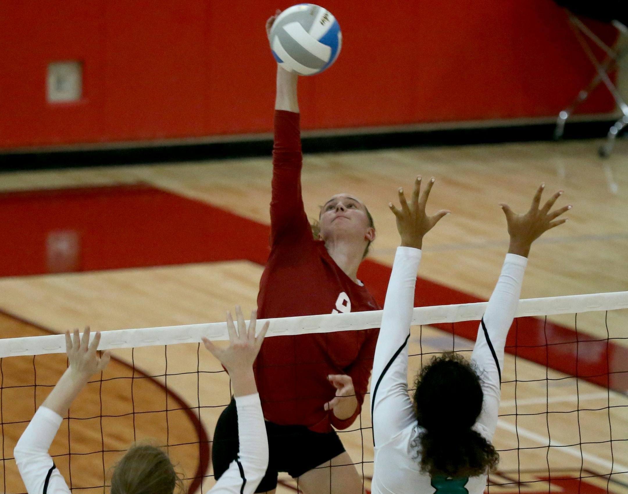 Lakeville South's Jenny Mosser spiked the ball against Eagan last season. She is among the many metro stars.