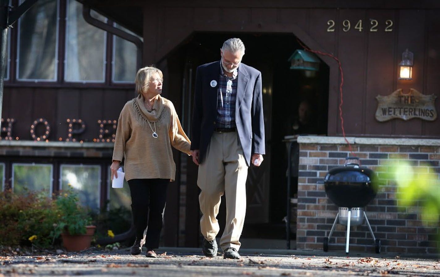 Patty and Jerry Wetterling walk out of their home to speak to the media in St. Joseph on Tuesday, November 3, 2015.