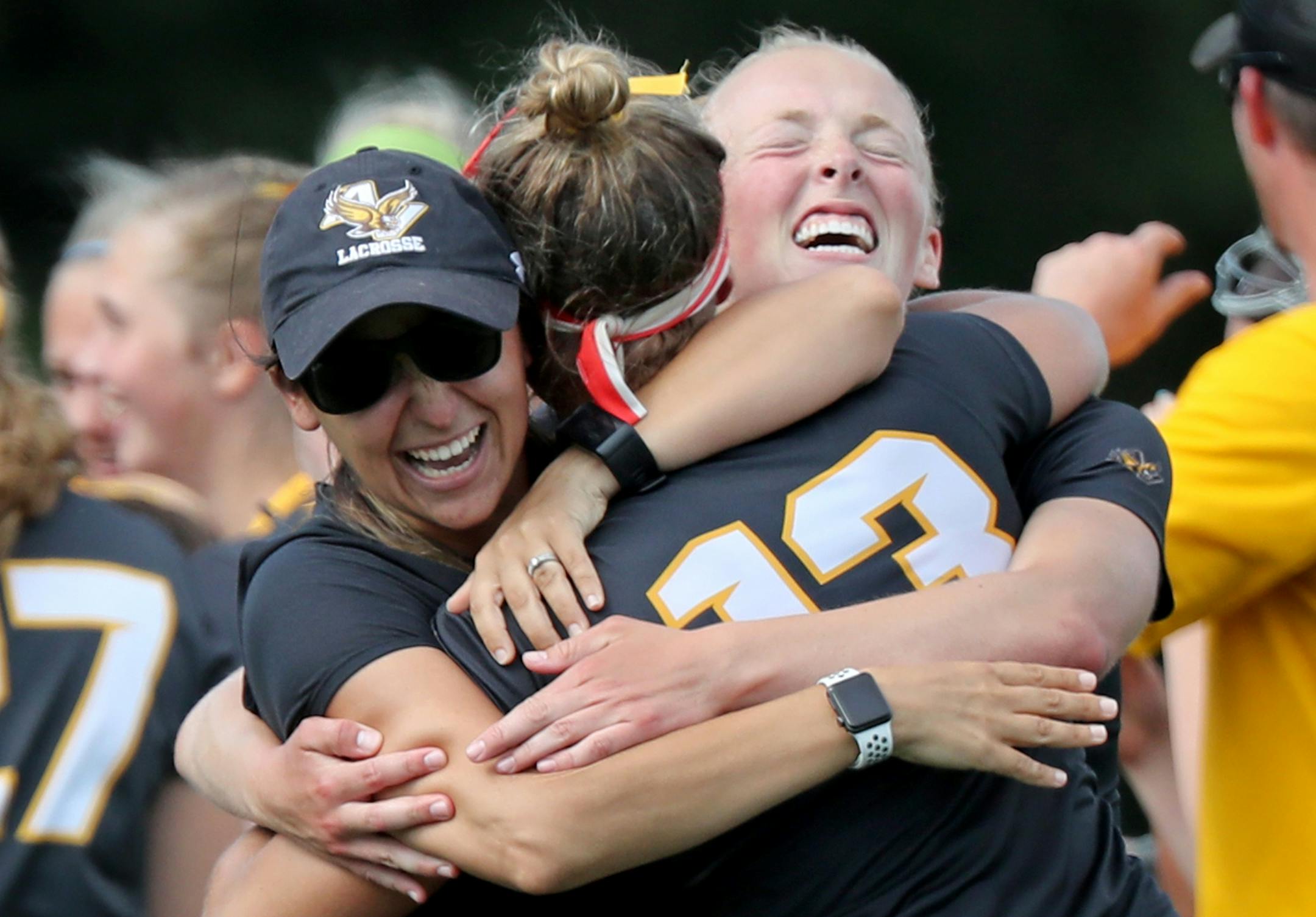 Apple Valley players and coaches, including Reagan Roelofs (13) celebrate their 11-10 win over Eden Prairie during the Minnesota State High School League girls' lacrosse championship at Chanhassen High in Chanhassen, MN.] DAVID JOLES Ô david.joles@startribune.com Apple Valley and Eden Prairie during the first half of the Minnesota State High School League girls' lacrosse championship at Chanhassen High in Chanhassen, MN. ORG XMIT: MIN1806161731290478