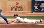 Minnesota Twins right fielder Max Kepler (26) scored on a triple in the second inning in front of Drew Butera of Kansas City at Target Field Wednesday