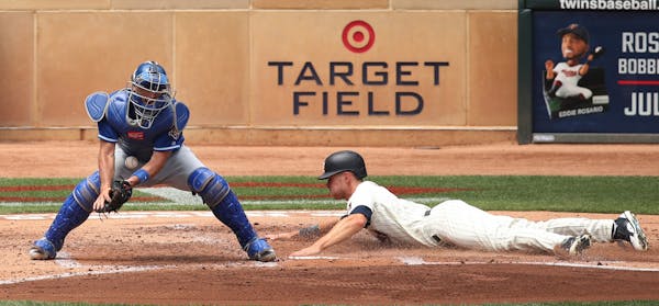 Minnesota Twins right fielder Max Kepler (26) scored on a triple in the second inning in front of Drew Butera of Kansas City at Target Field Wednesday