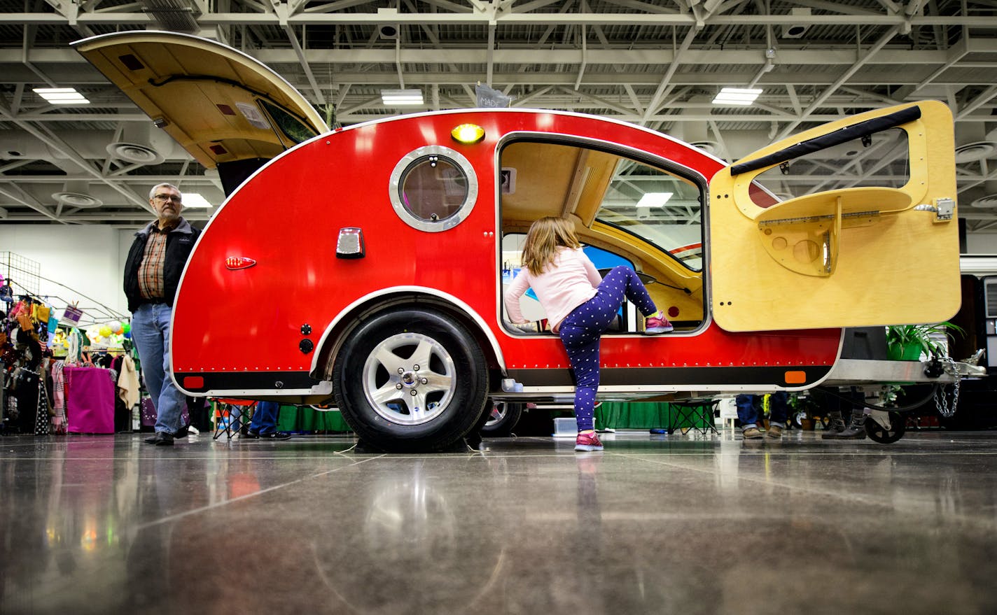 Ashley Ritchie, 5, couldn't resist climbing into a bright red St. Paul-made Vistabule Teardrop Trailer at the Minneapolis/St. Paul RV Vacation and Camping Show on Thursday. Hundreds of RVs from 15 dealers filled up the Minneapolis Convention Center along with over a hundred RV related vendors, running through this weekend.