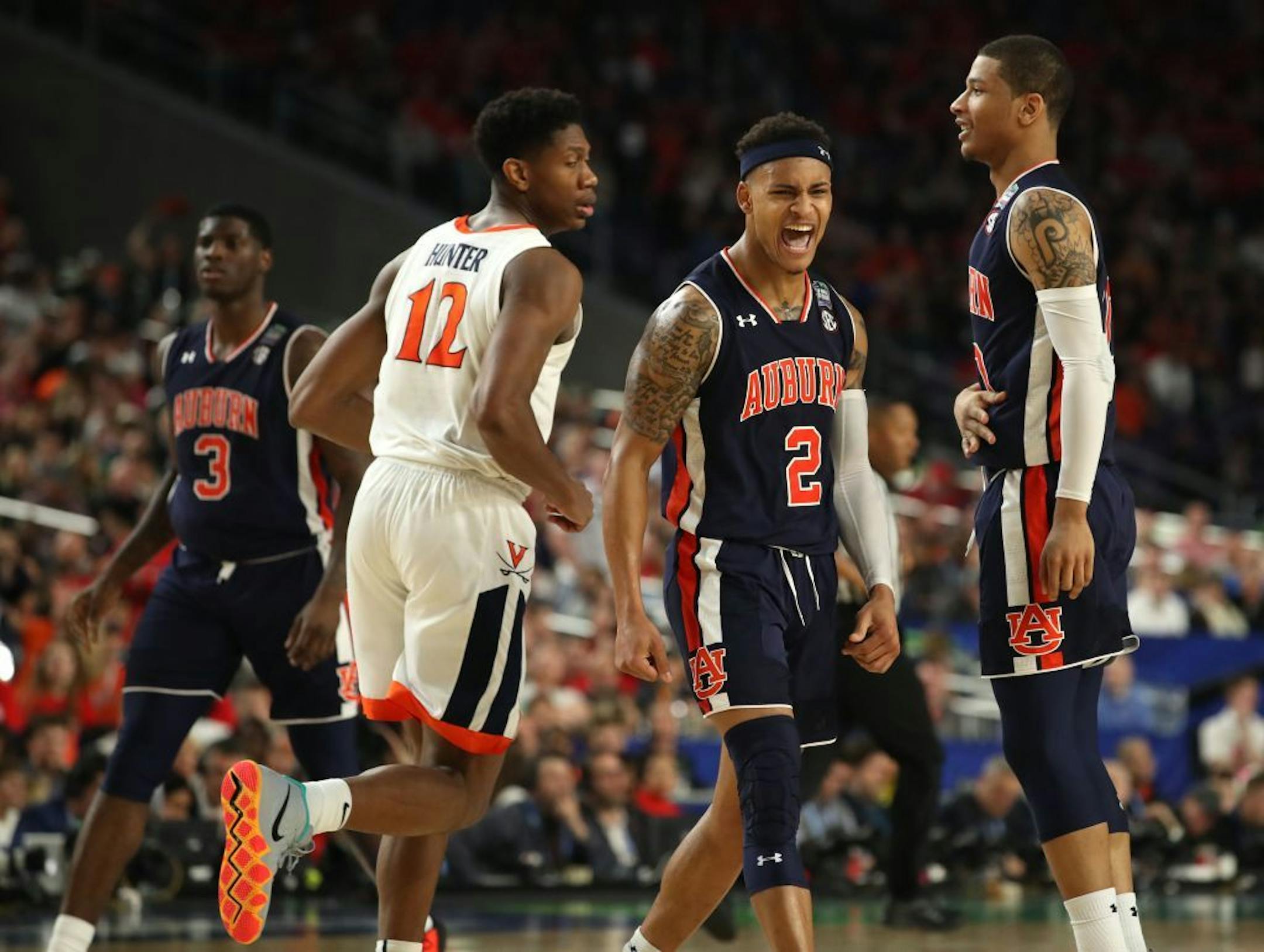 Auburn guard Bryce Brown (2) reacted after making a three point basket against Virginia during the second half.