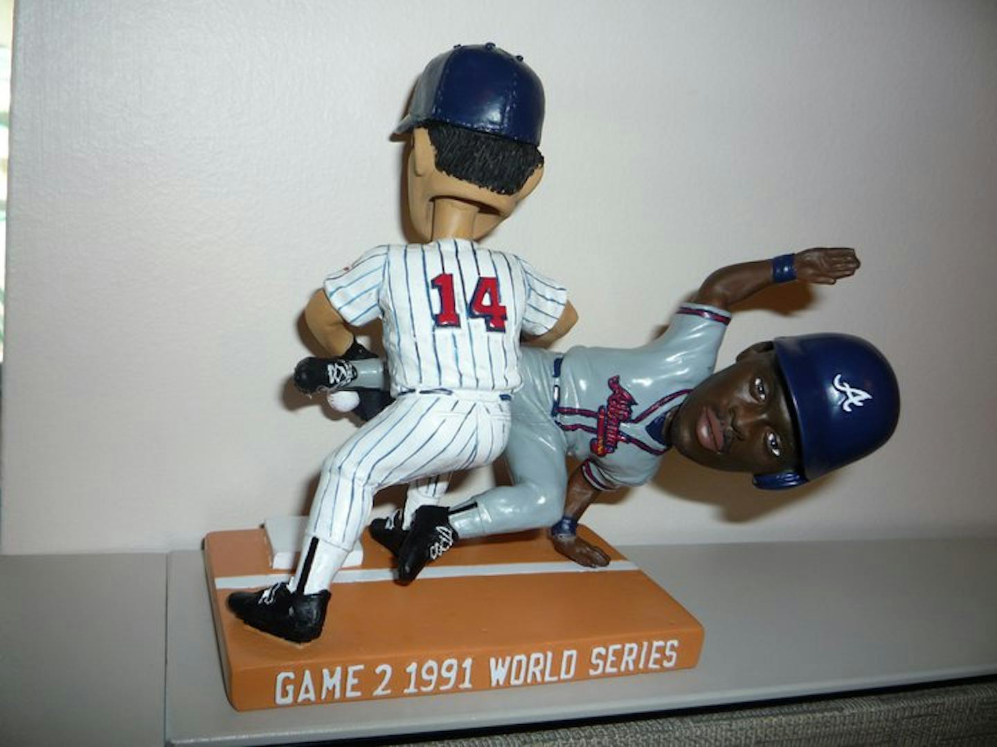 Bobblehead immortalizes 1991 World Series play involving Kent Hrbek and Ron Gant.