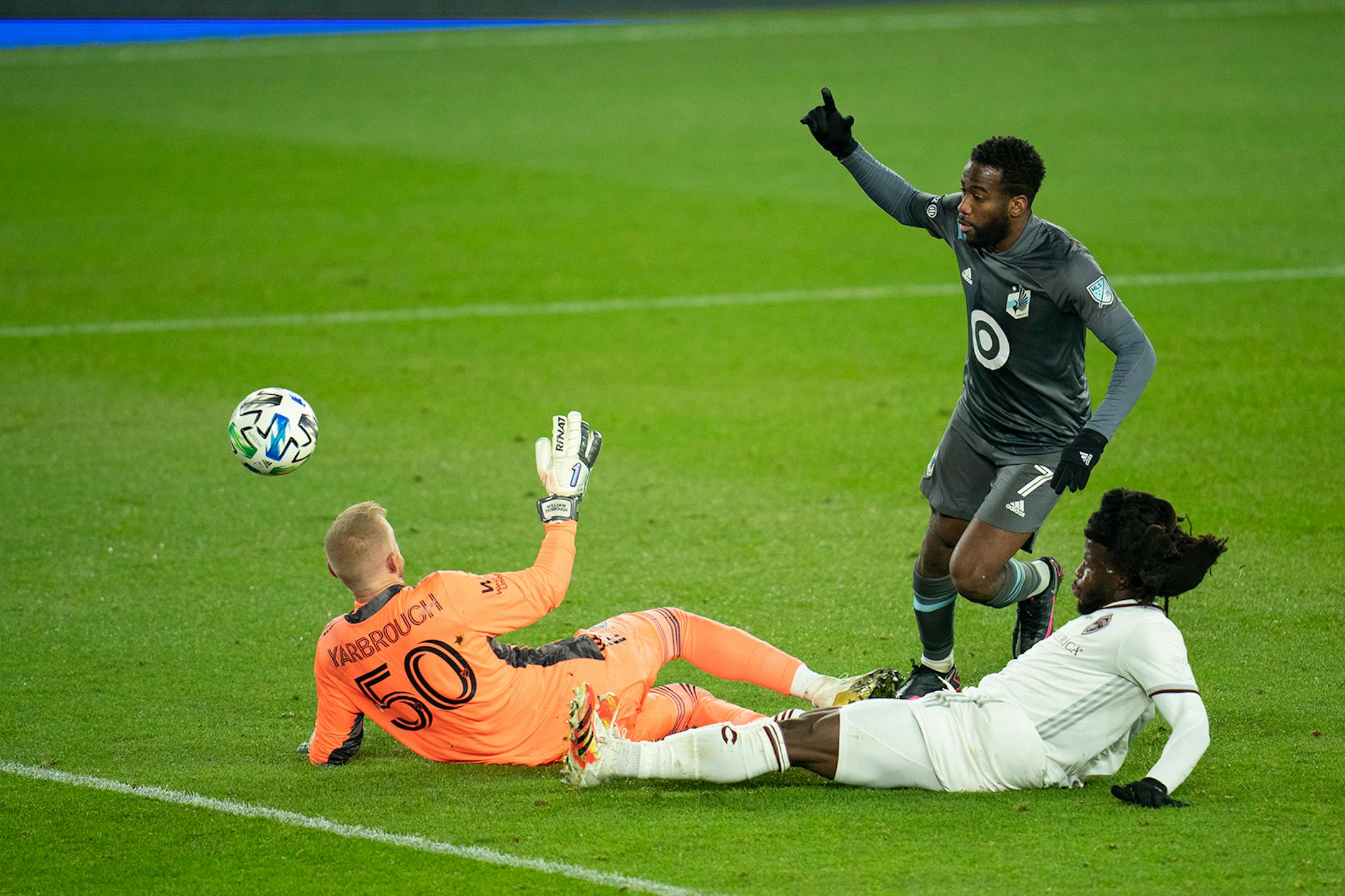 Minnesota United midfielder Kevin Molino (7) scored his second goal of the game with this shot over Colorado Rapids goalkeeper William Yarbrough (50) with Rapids defender Lalas Abubakar (6) coming late to defend.