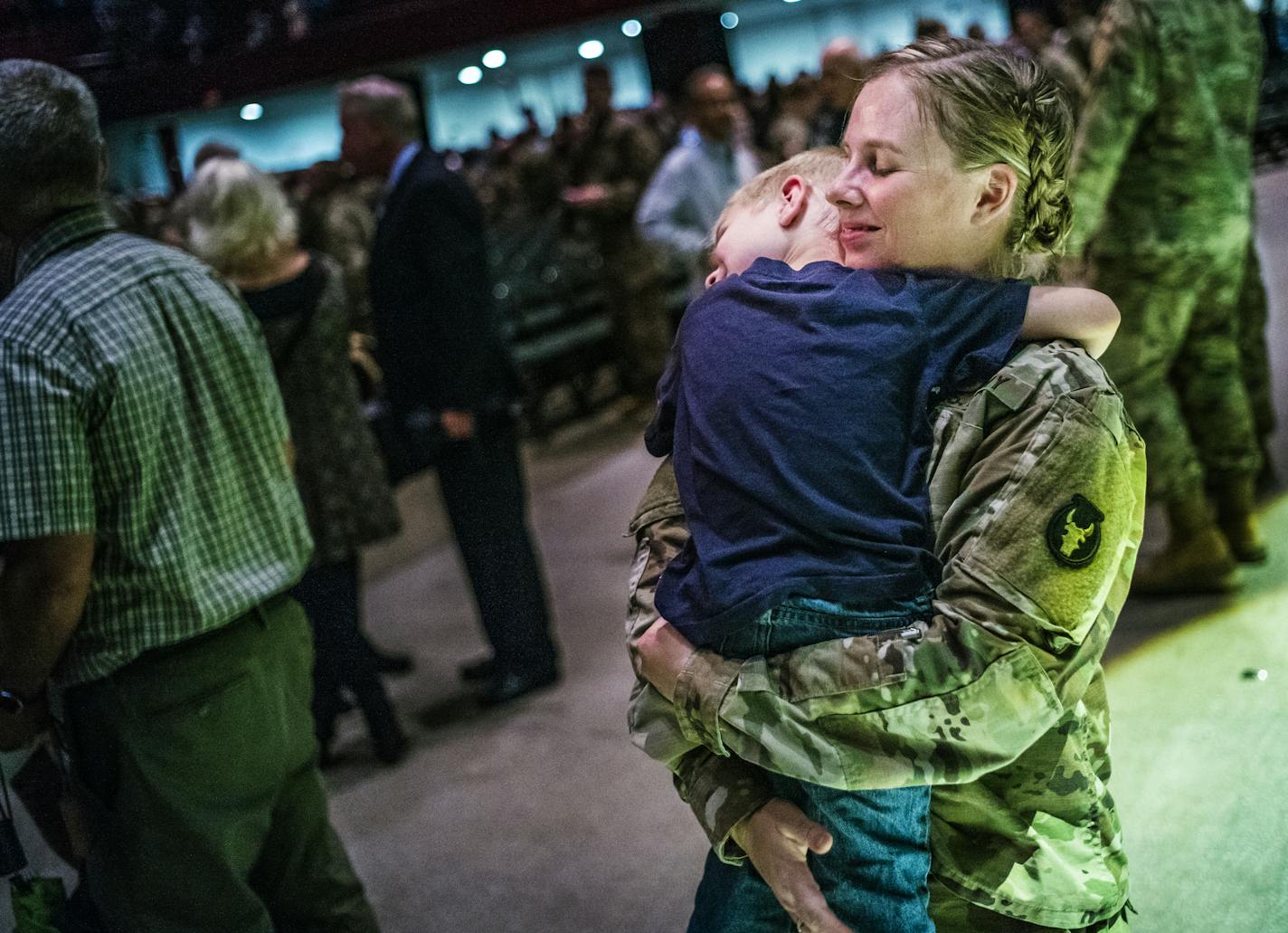 Stephanie Christoffels, a captain and a chaplain held on tight to son David,4 after the departure ceremony. She will be deployed for 10 months and has two other kids, Nicholas,6, and Emma,1.] A departure ceremony for about 650 soldiers in the 34th Red Bull Infantry Dvision, based in Rosemount, for a nine-month deployment in Kuwait. Richard Tsong-Taatarii@startribune.com