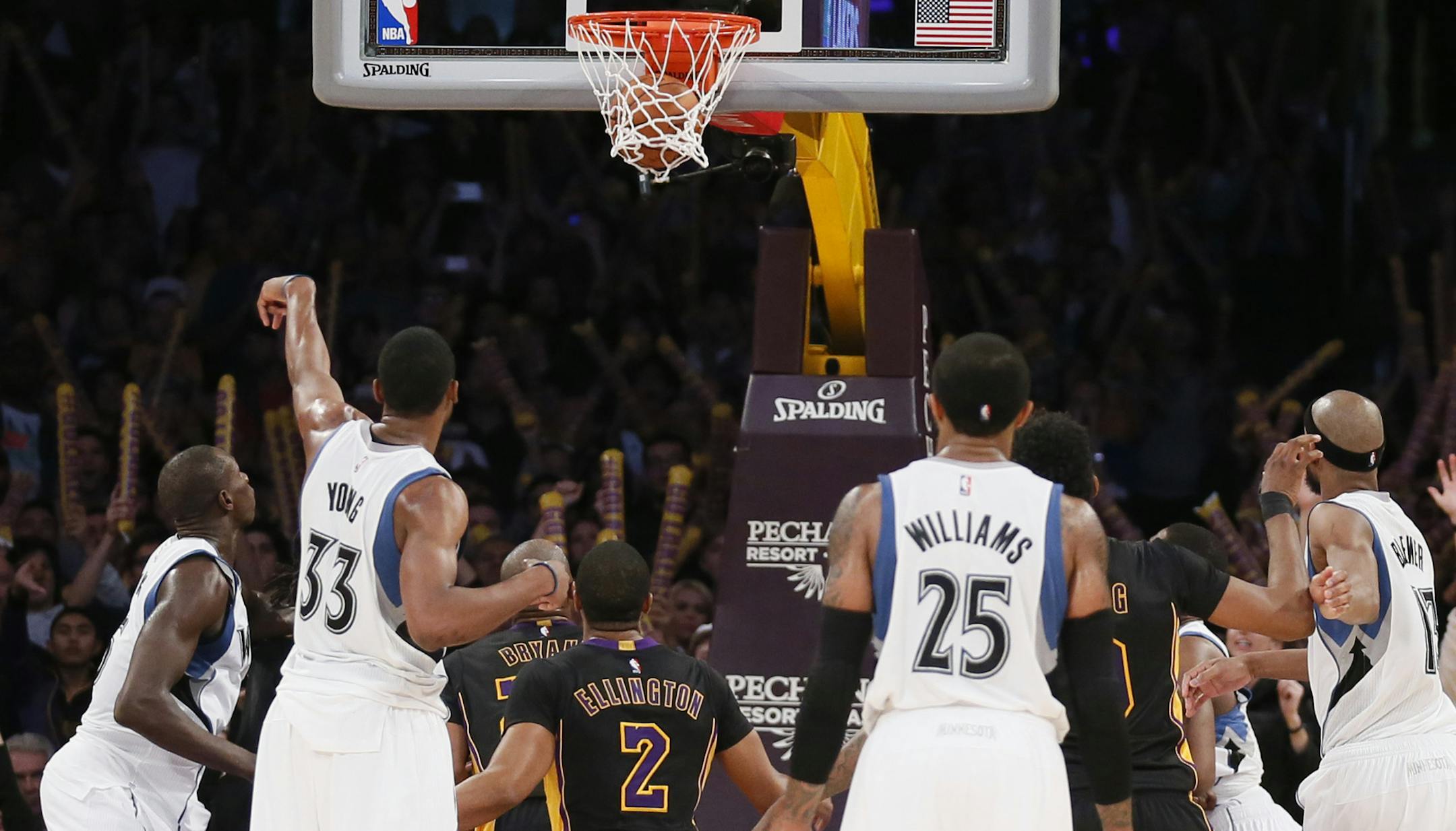 Minnesota Timberwolves' Thaddeus Young makes the second of two free throws with 2.8 seconds left against the Los Angeles Lakers during the second half of an NBA basketball game Friday, Nov. 28, 2014, in Los Angeles. The Timberwolves won 120-119. (AP Photo/Danny Moloshok) ORG XMIT: LAS112