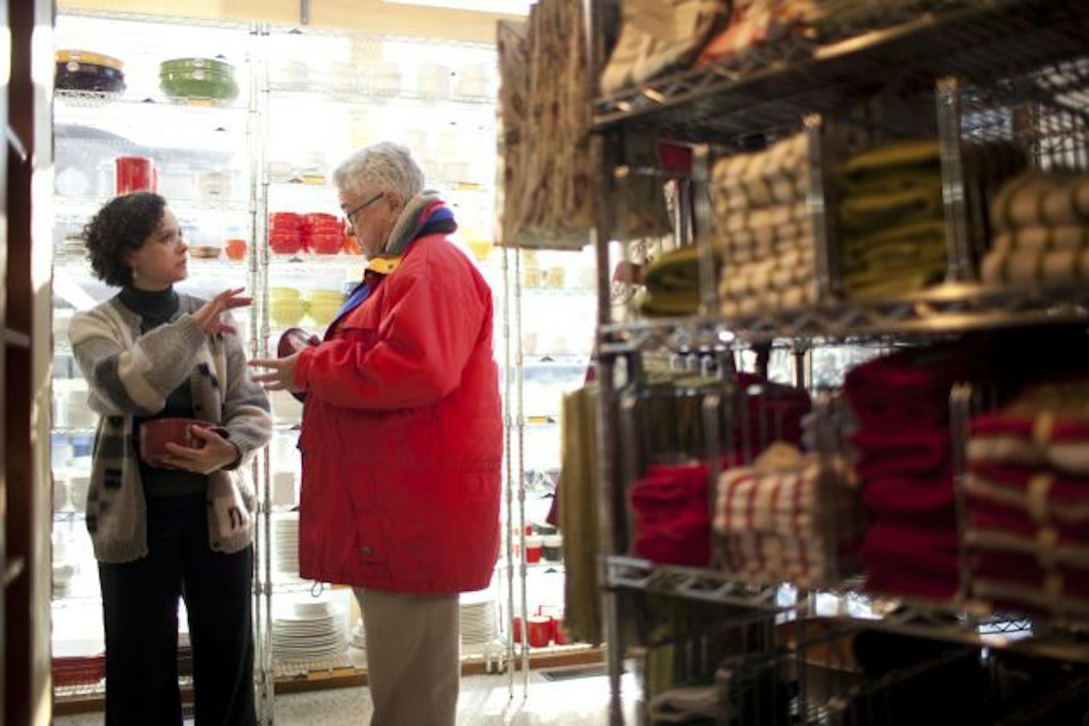 David Francis of Minneapolis consulted with Elisa Lobo Neese about a gift at Cooks of Crocus Hill's store on Grand Avenue in St. Paul Monday. Ten-day weather forecasts indicate that retailers won't be hit with any more blizzards as holiday shopping wraps up.