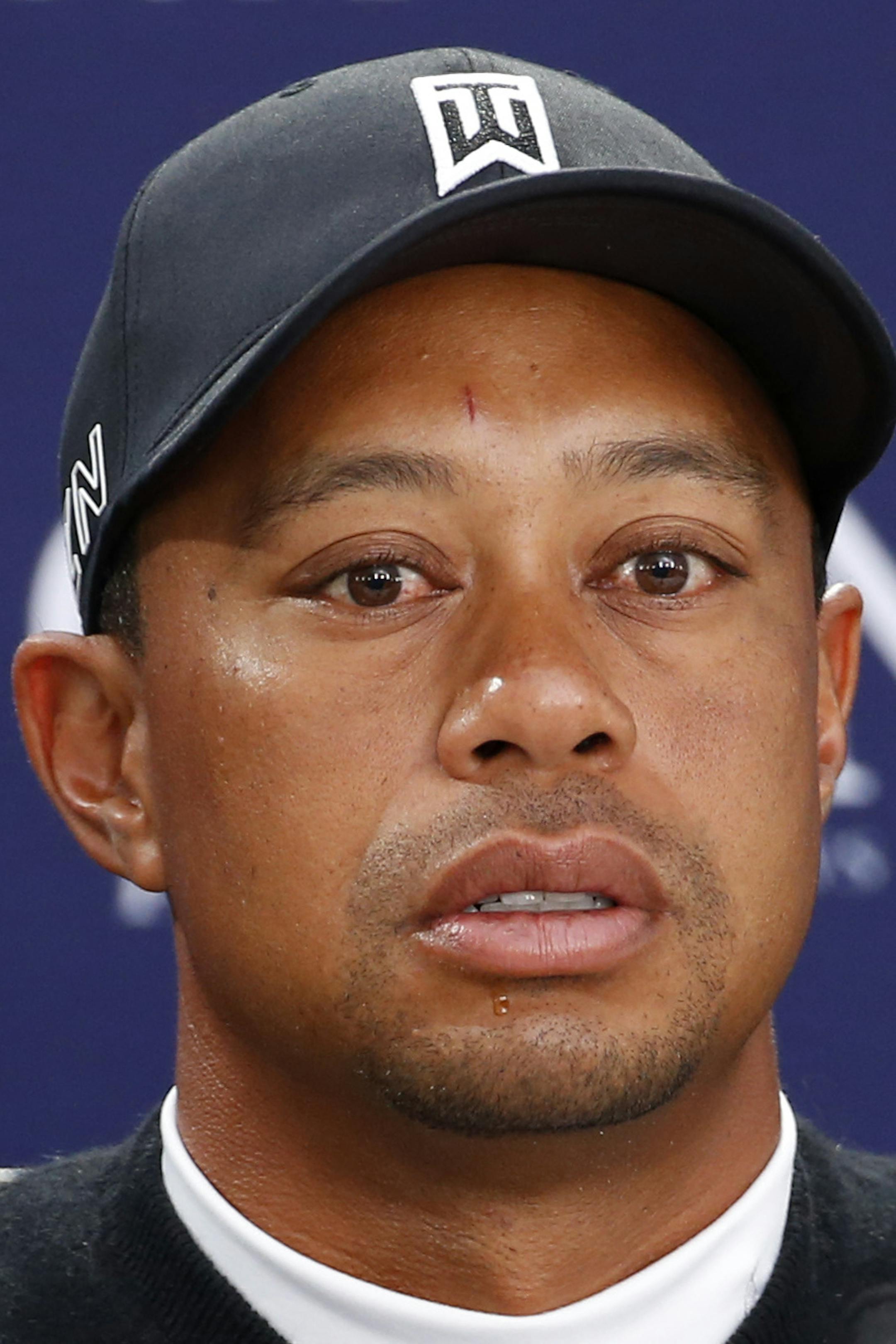 United States&#xed; Tiger Woods speaks during a news conference ahead of a practice round at the British Open Golf Championship at the Old Course, St. Andrews, Scotland, Tuesday, July 14, 2015. (AP Photo/Jon Super)