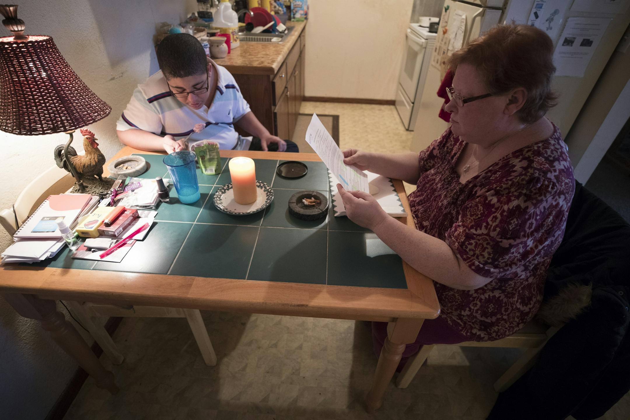 Cora Mustin read a letter that her 15-year-old son Jordan Mustin bought home from school as he ate a snack Thursday December 14, 2017 in Mounds View, MN. Jordan has autism and a history of violent outbursts toward himself and family.